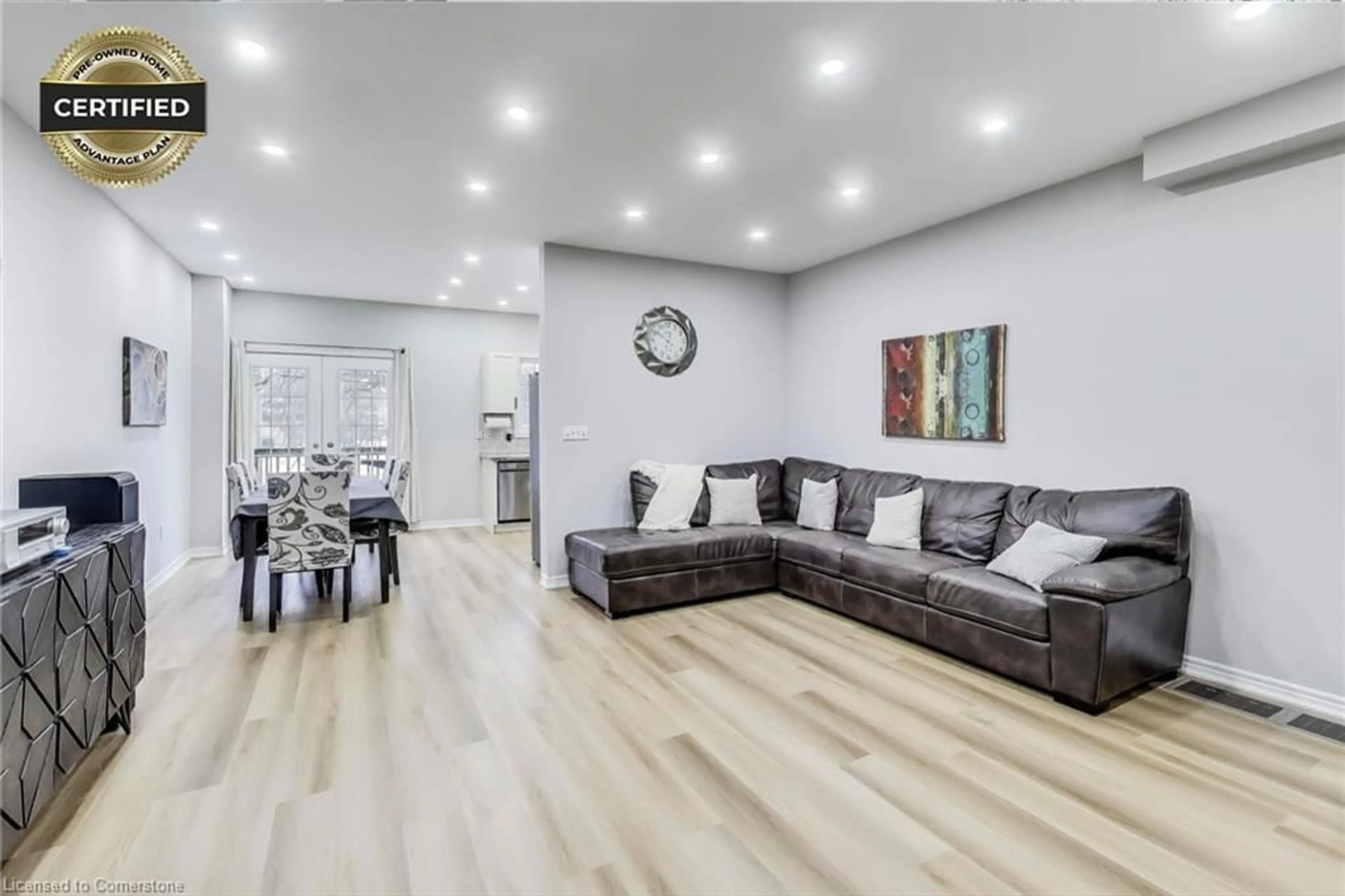 Living room with furniture, wood/laminate floor for 7 Joseph St, Brampton Ontario L6X 0J3