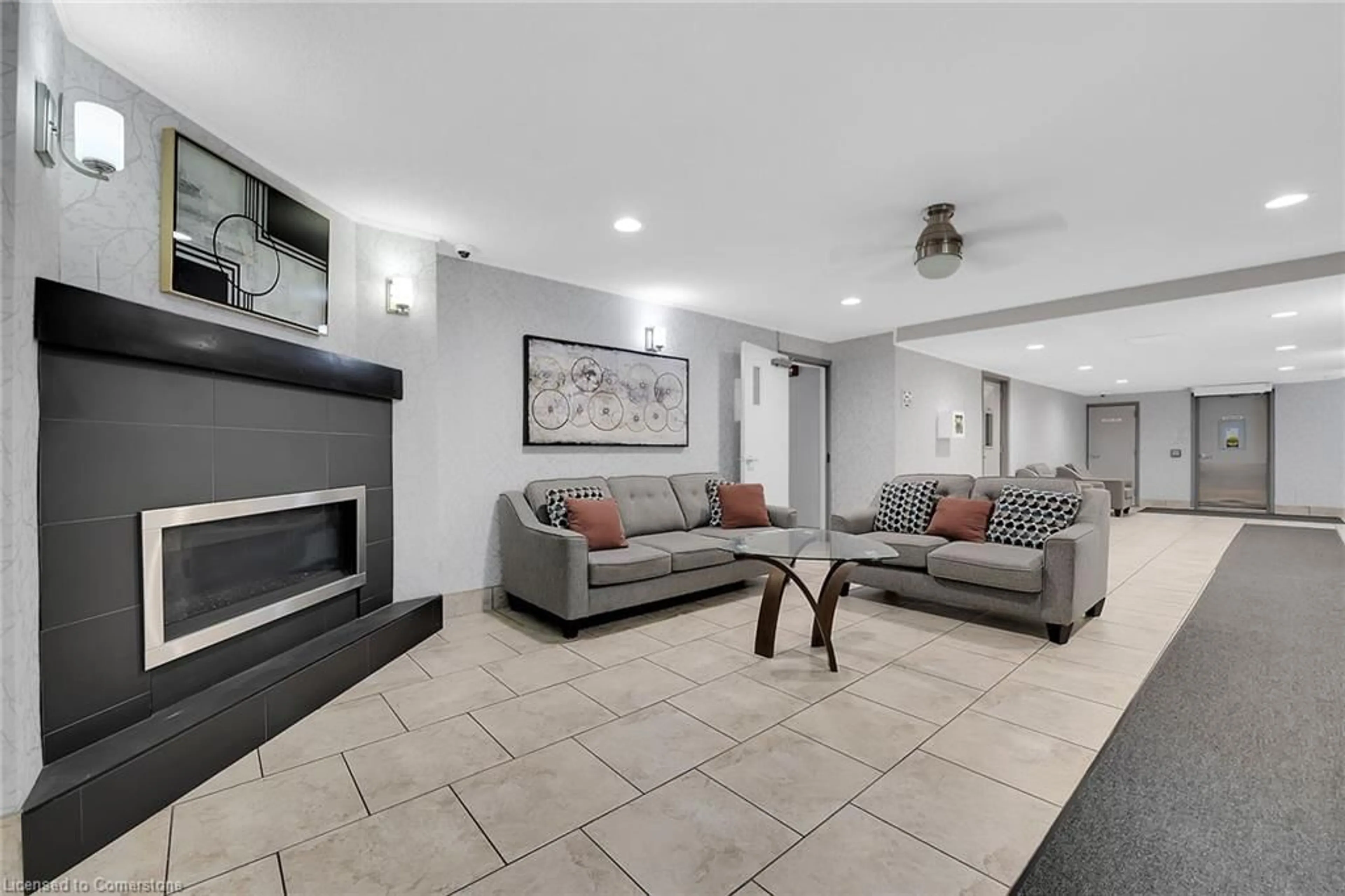 Living room with furniture, ceramic/tile floor for 198 Scott St #220, St. Catharines Ontario L2N 5T3
