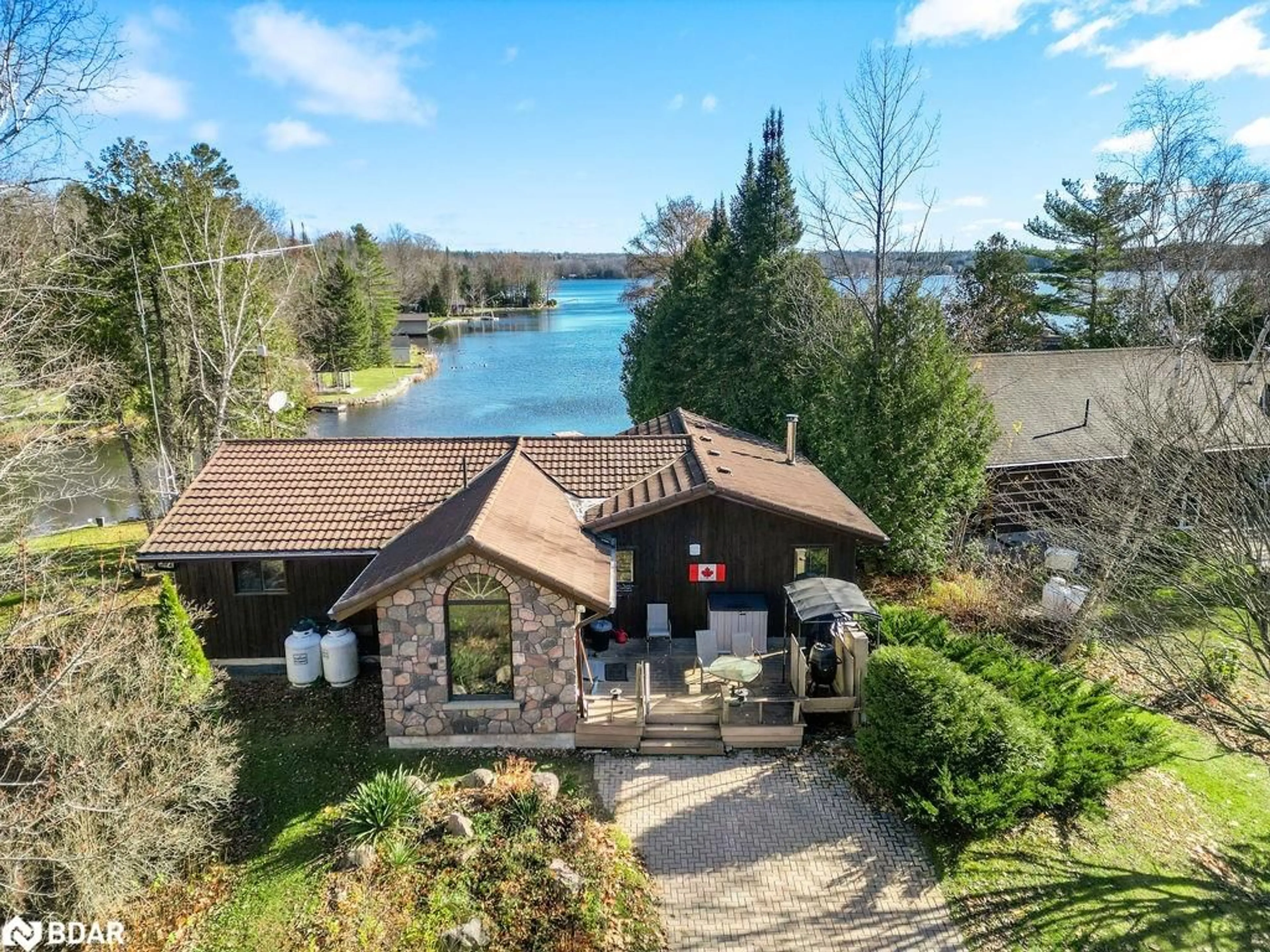 A pic from outside/outdoor area/front of a property/back of a property/a pic from drone, water/lake/river/ocean view for 217 Adam And Eve Rd, Buckhorn Ontario K0L 1J0