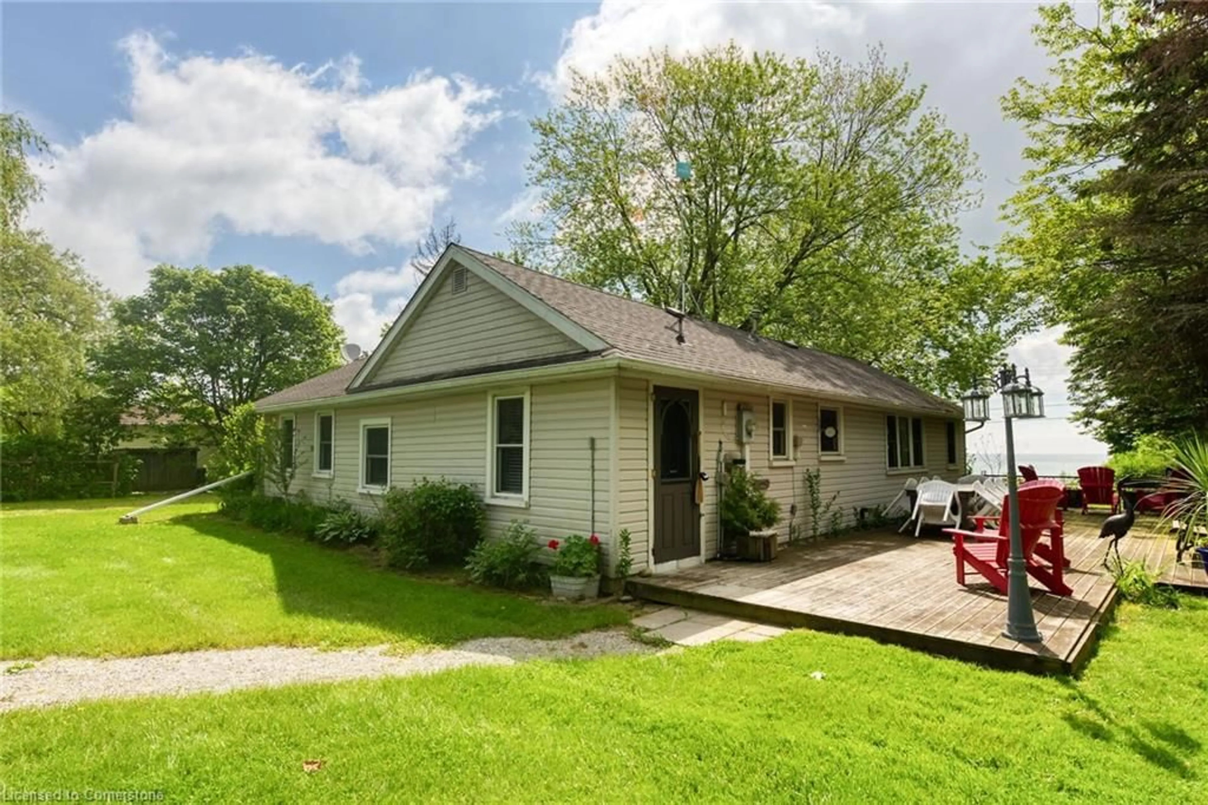 Home with vinyl exterior material, street for 2593 North Shore Dr, Lowbanks Ontario N0A 1K0