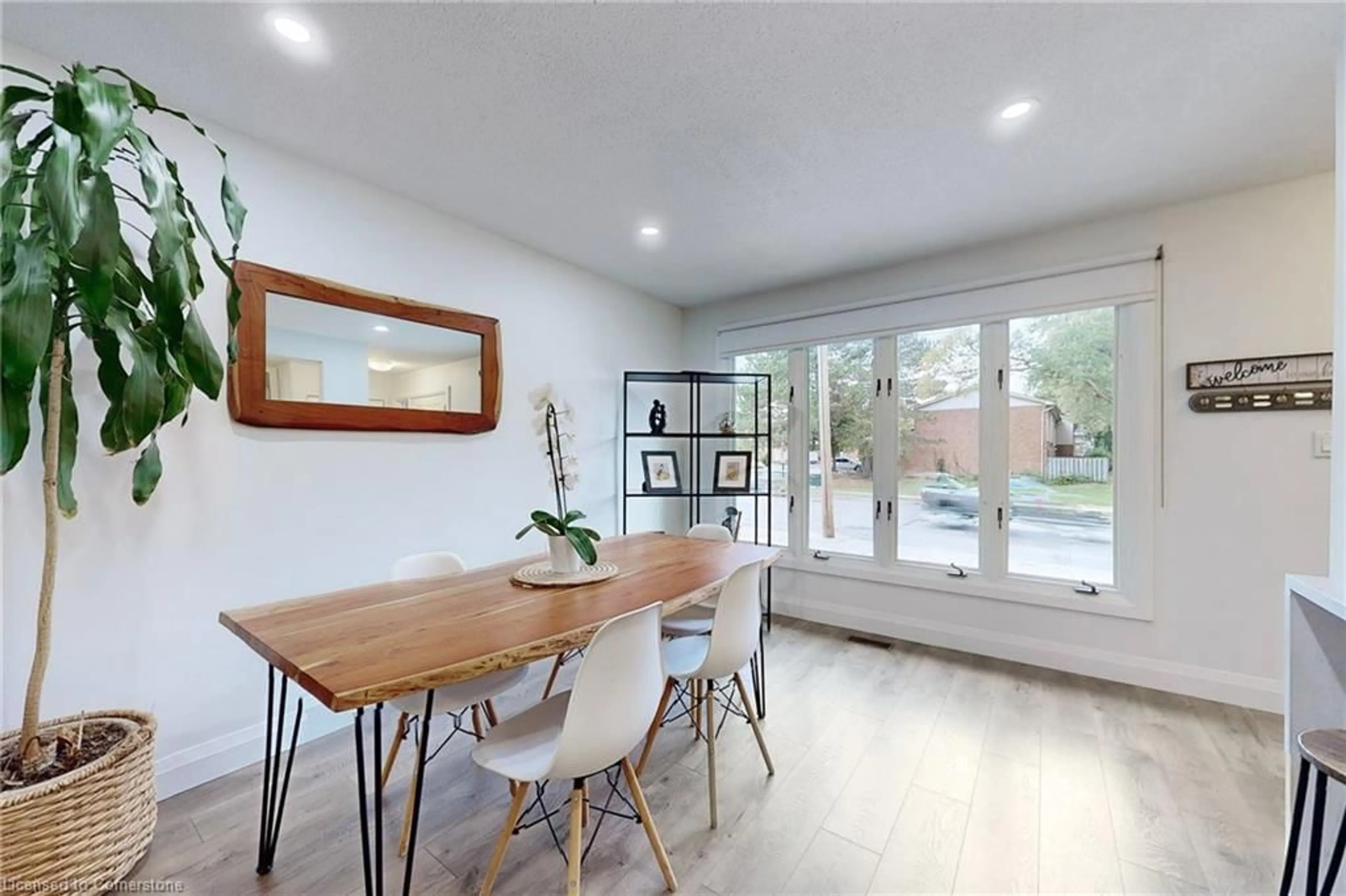 Dining room, wood/laminate floor for 49 Quigley Rd, Hamilton Ontario L8K 6K9