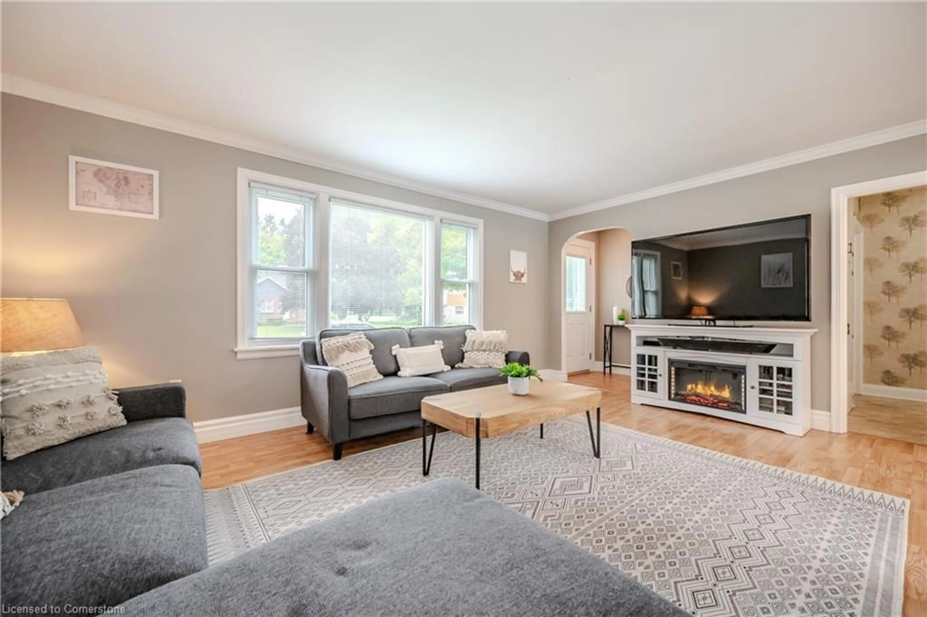 Living room with furniture, wood/laminate floor for 36814 Crediton Rd, Dashwood Ontario N0M 1N0