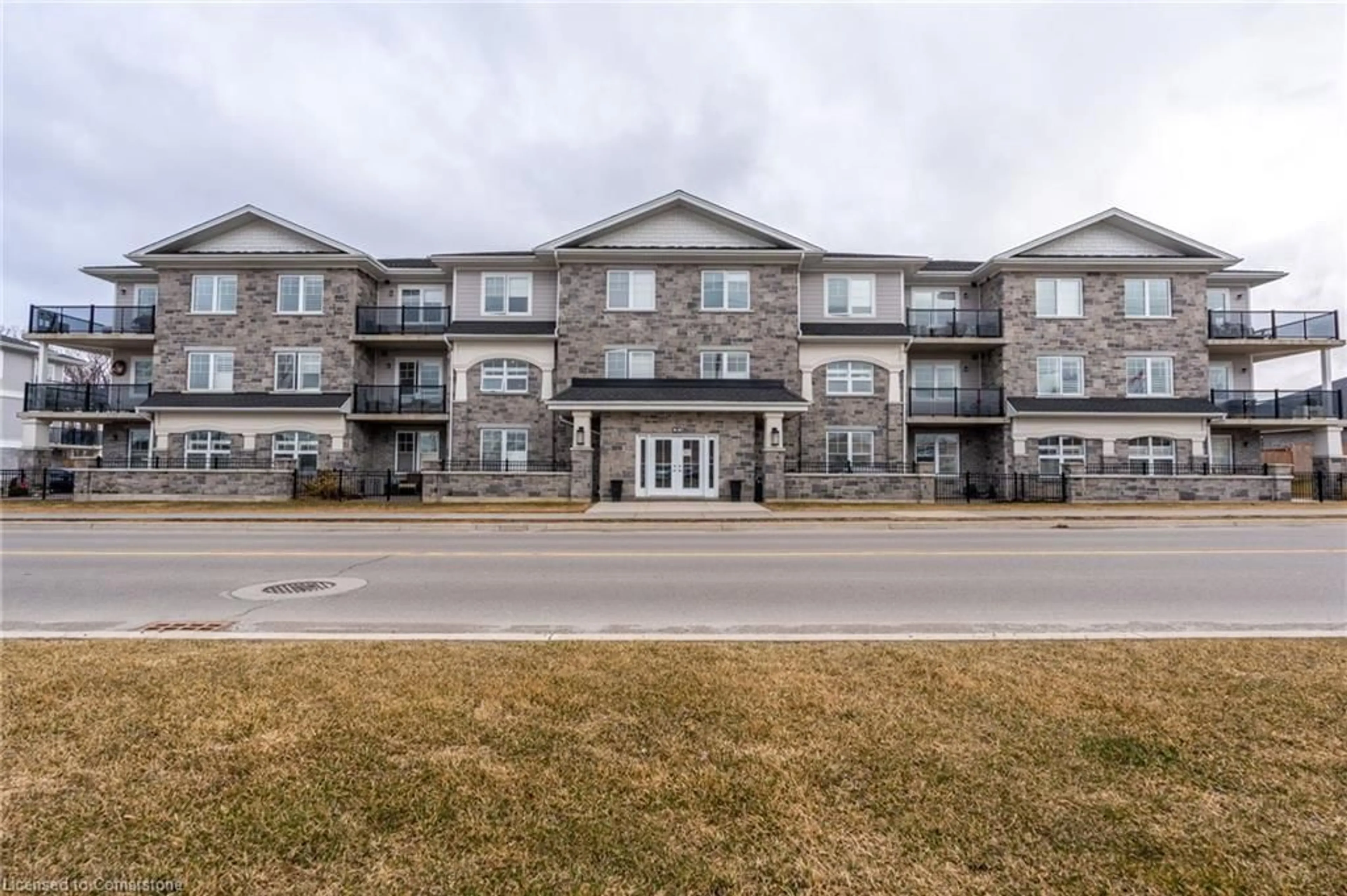 A pic from outside/outdoor area/front of a property/back of a property/a pic from drone, building for 65 Haddington St #306, Caledonia Ontario N3W 2H2