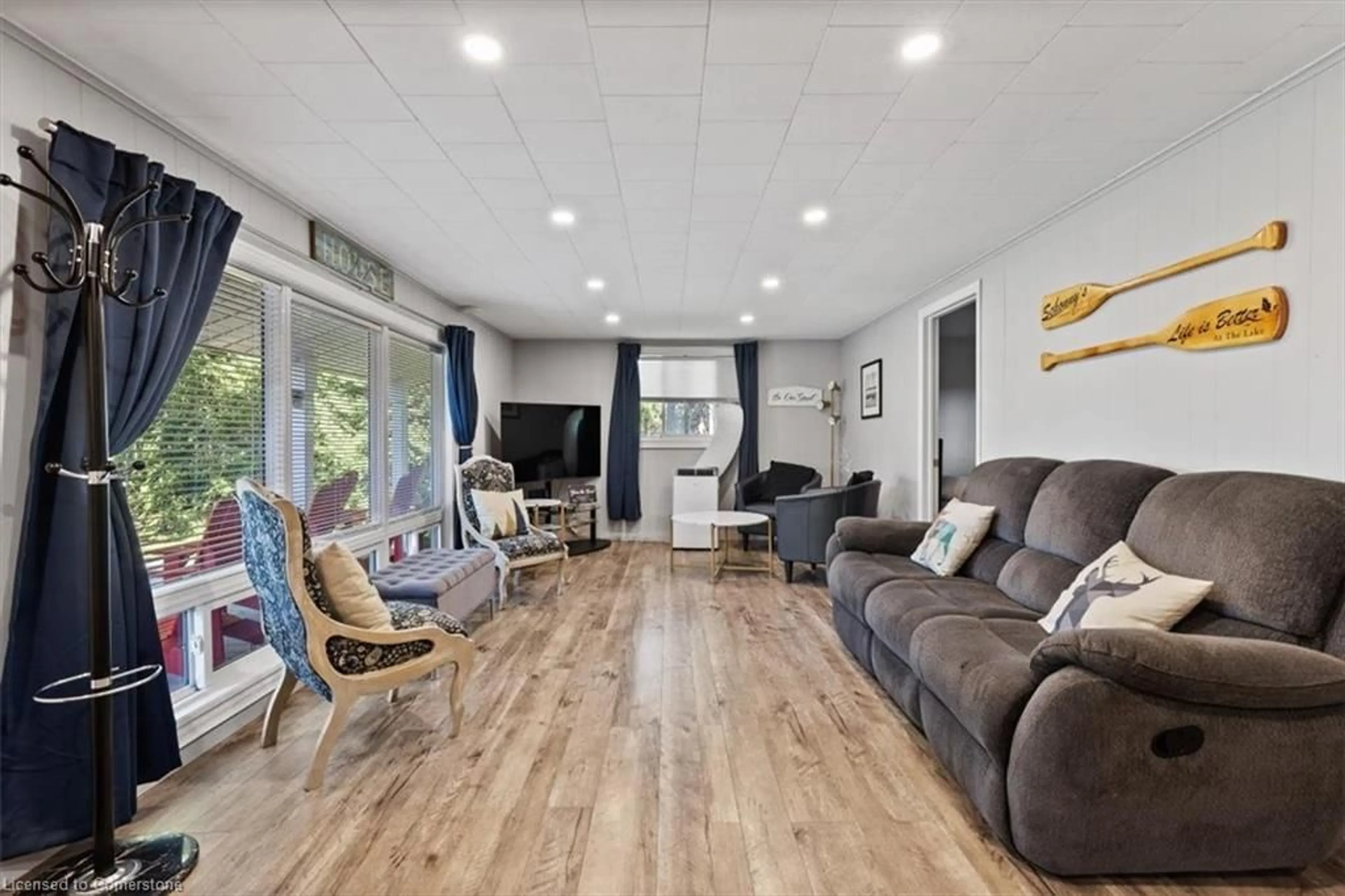 Living room with furniture, wood/laminate floor for 38 Macpherson Cres, Kawartha Lakes Ontario K0M 2B0