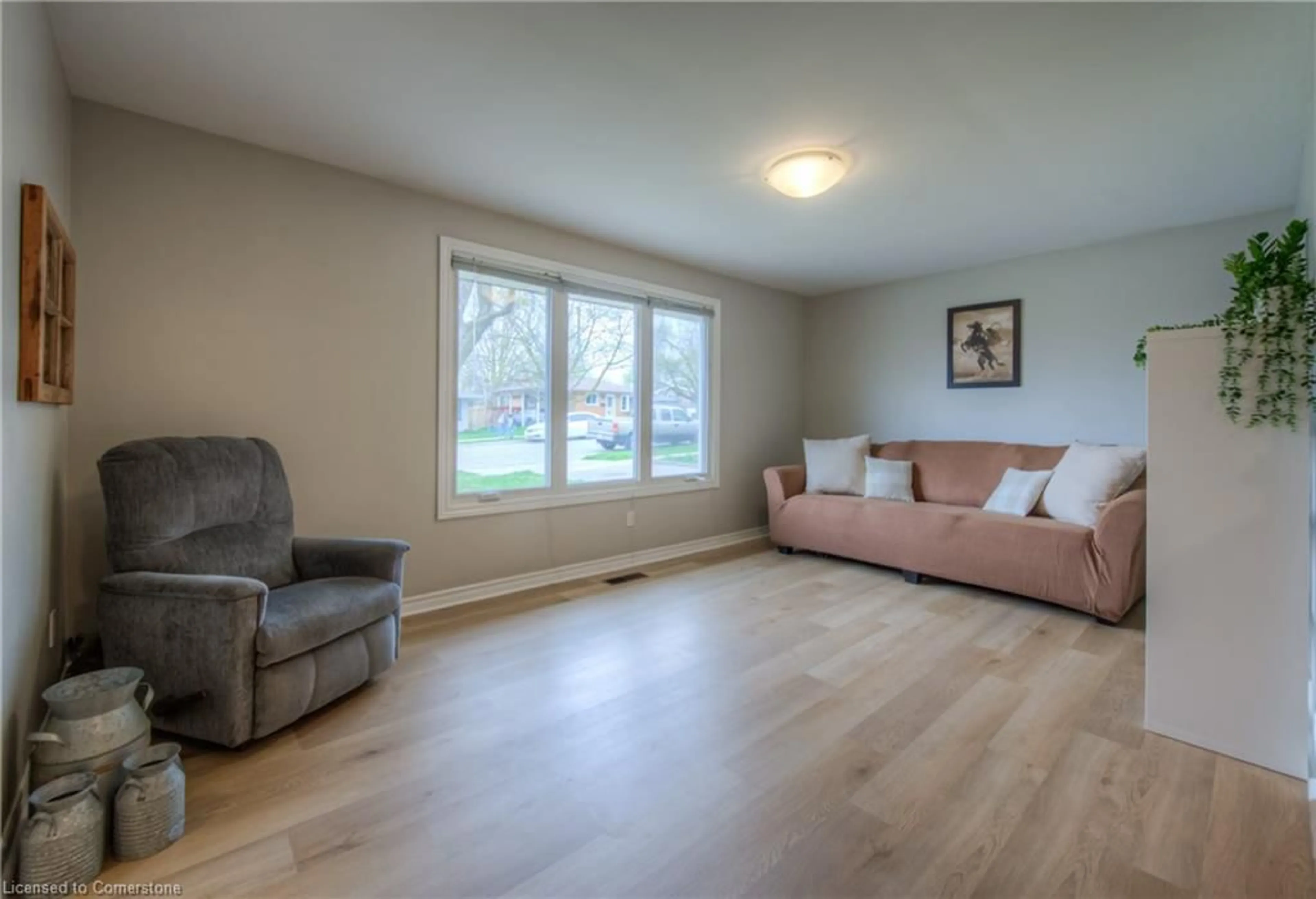 Living room with furniture, wood/laminate floor for 89 Lowrey Ave, Cambridge Ontario N1R 4Z7