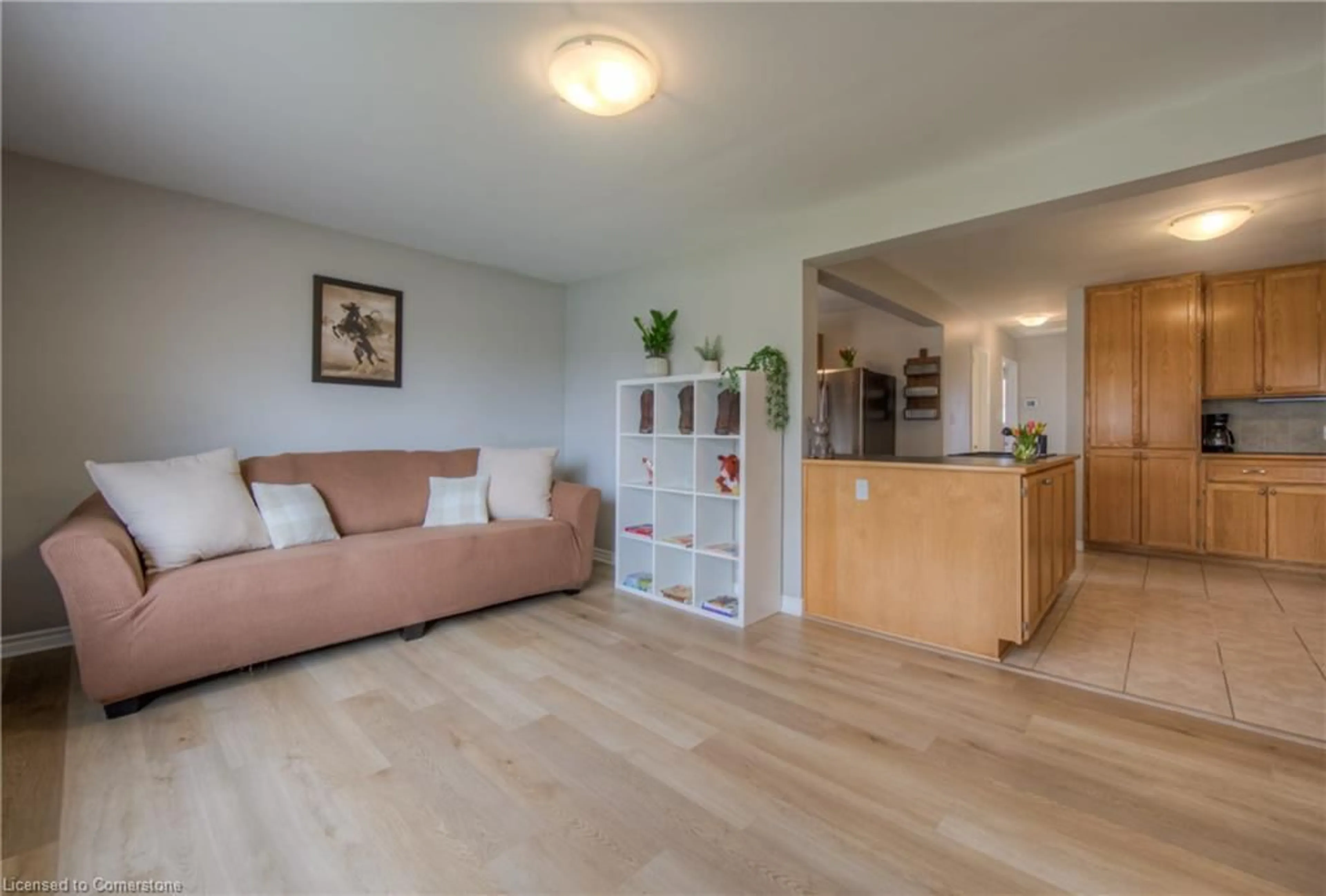 Living room with furniture, wood/laminate floor for 89 Lowrey Ave, Cambridge Ontario N1R 4Z7