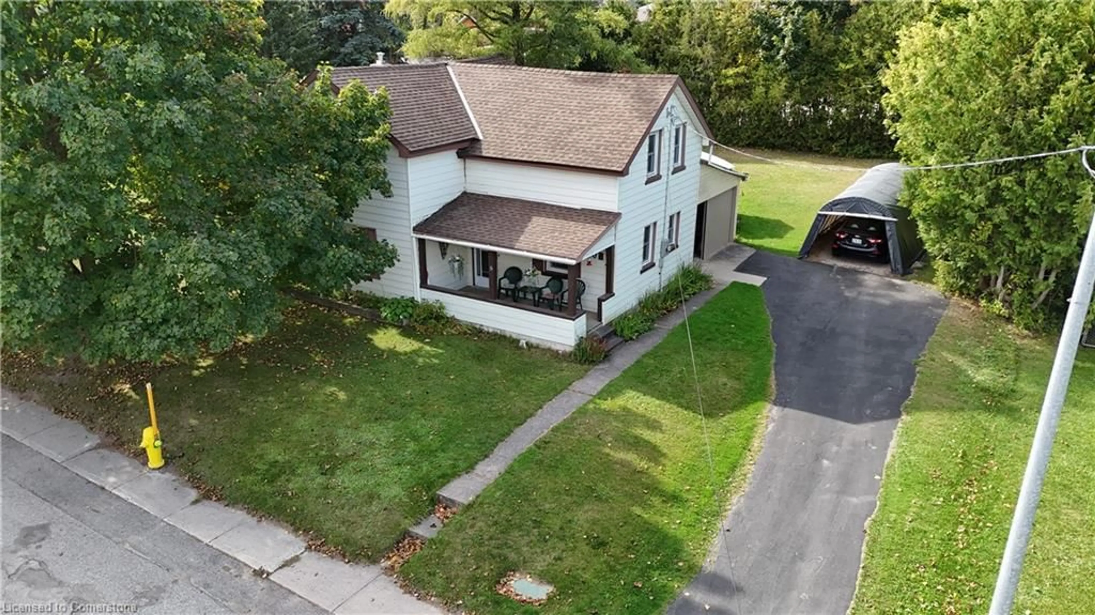 A pic from outside/outdoor area/front of a property/back of a property/a pic from drone, street for 208 Edward St, Wingham Ontario N0G 2W0