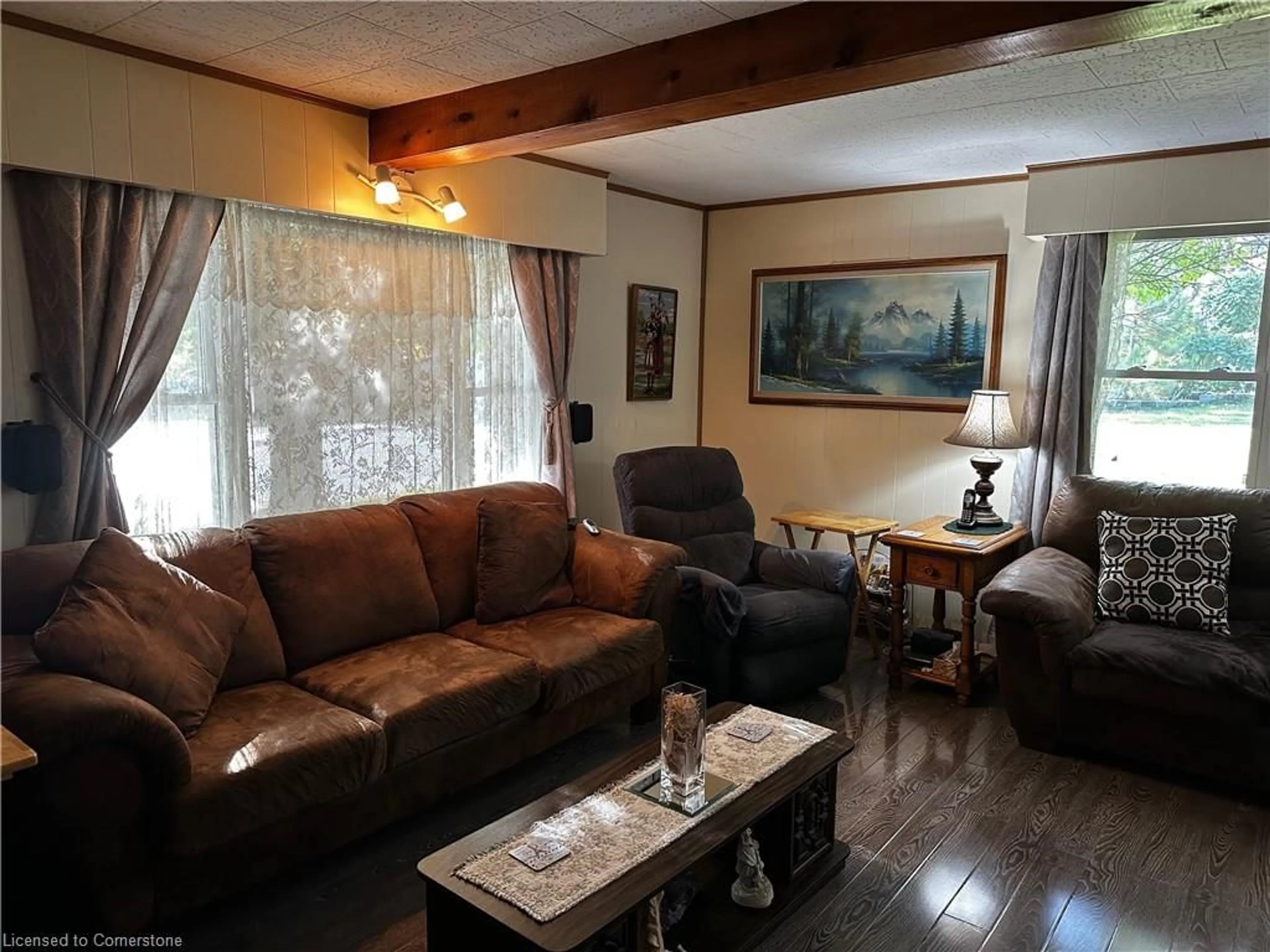 Living room with furniture, wood/laminate floor for 208 Edward St, Wingham Ontario N0G 2W0