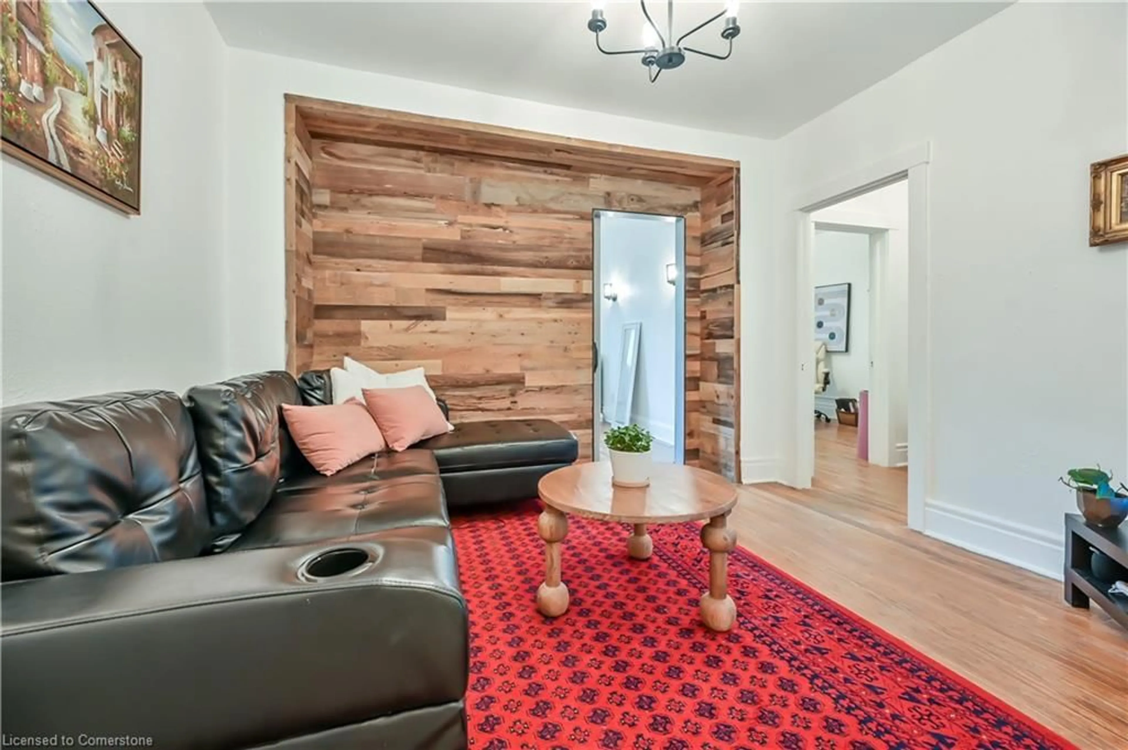 Living room with furniture, wood/laminate floor for 285 King St #8, Hamilton Ontario L8P 1B2