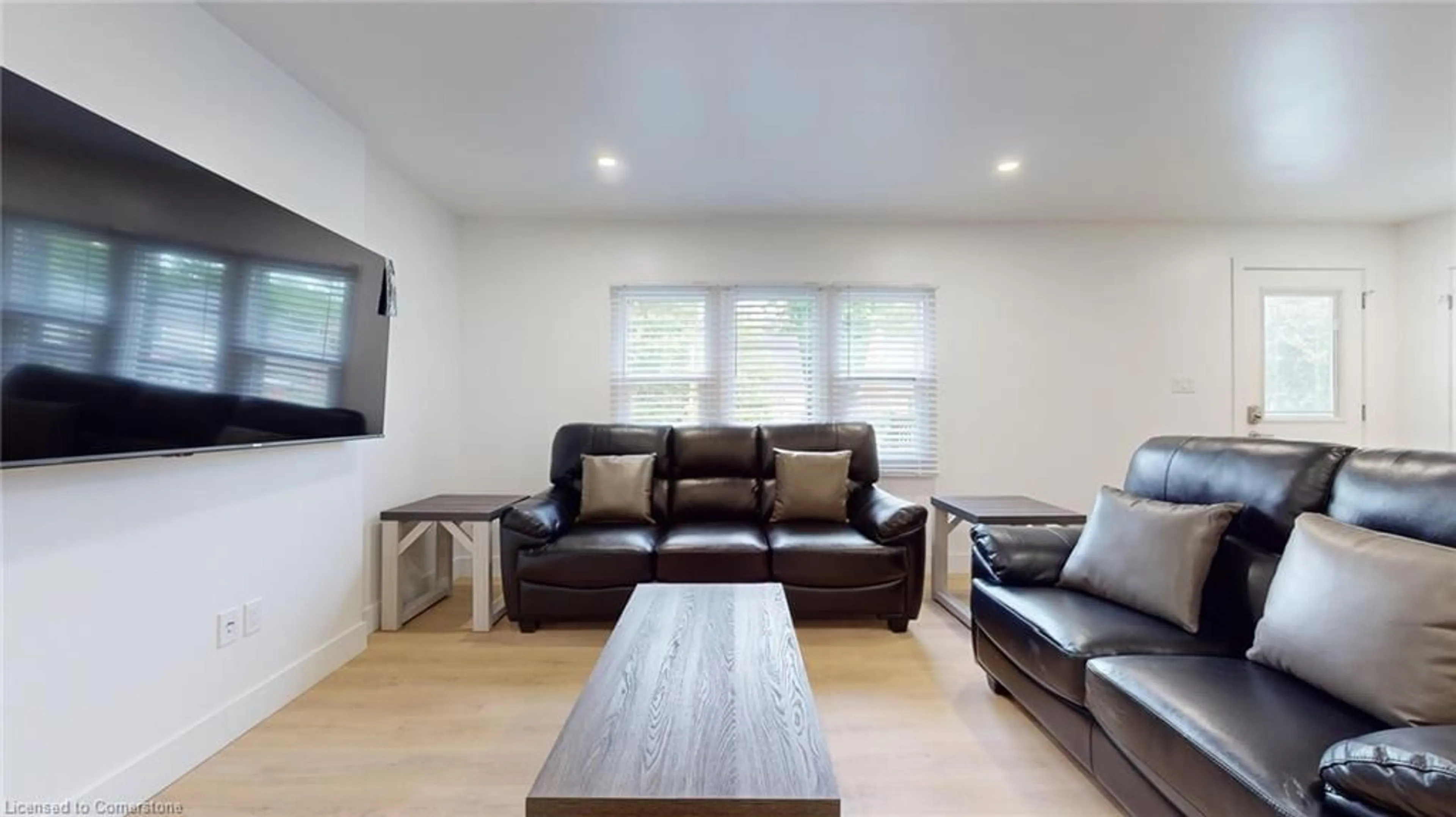 Living room with furniture, wood/laminate floor for 38 Albion St, London Ontario N6H 1Z2