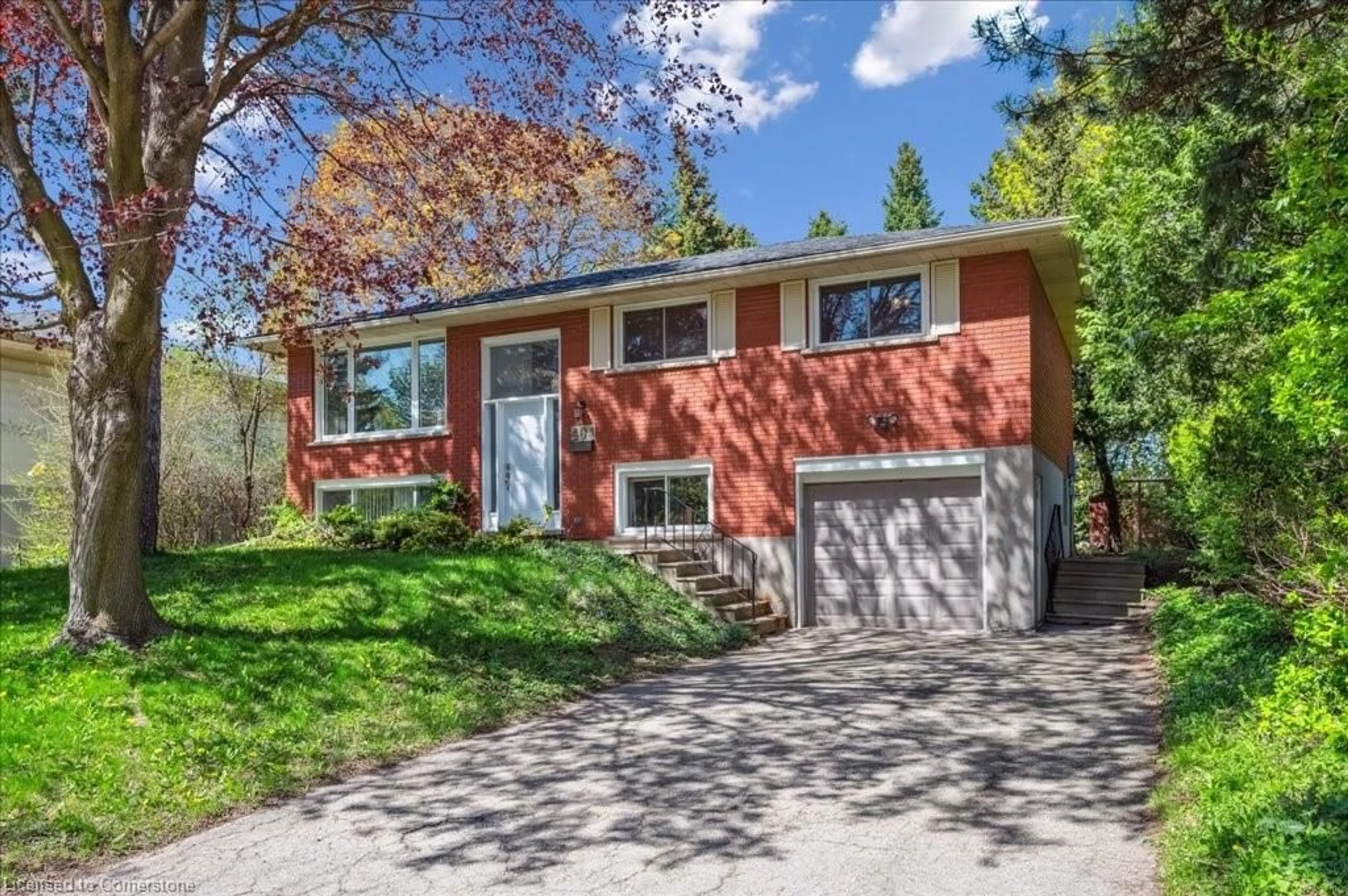 Home with brick exterior material, street for 404 Tamarack Dr, Waterloo Ontario N2L 4G6