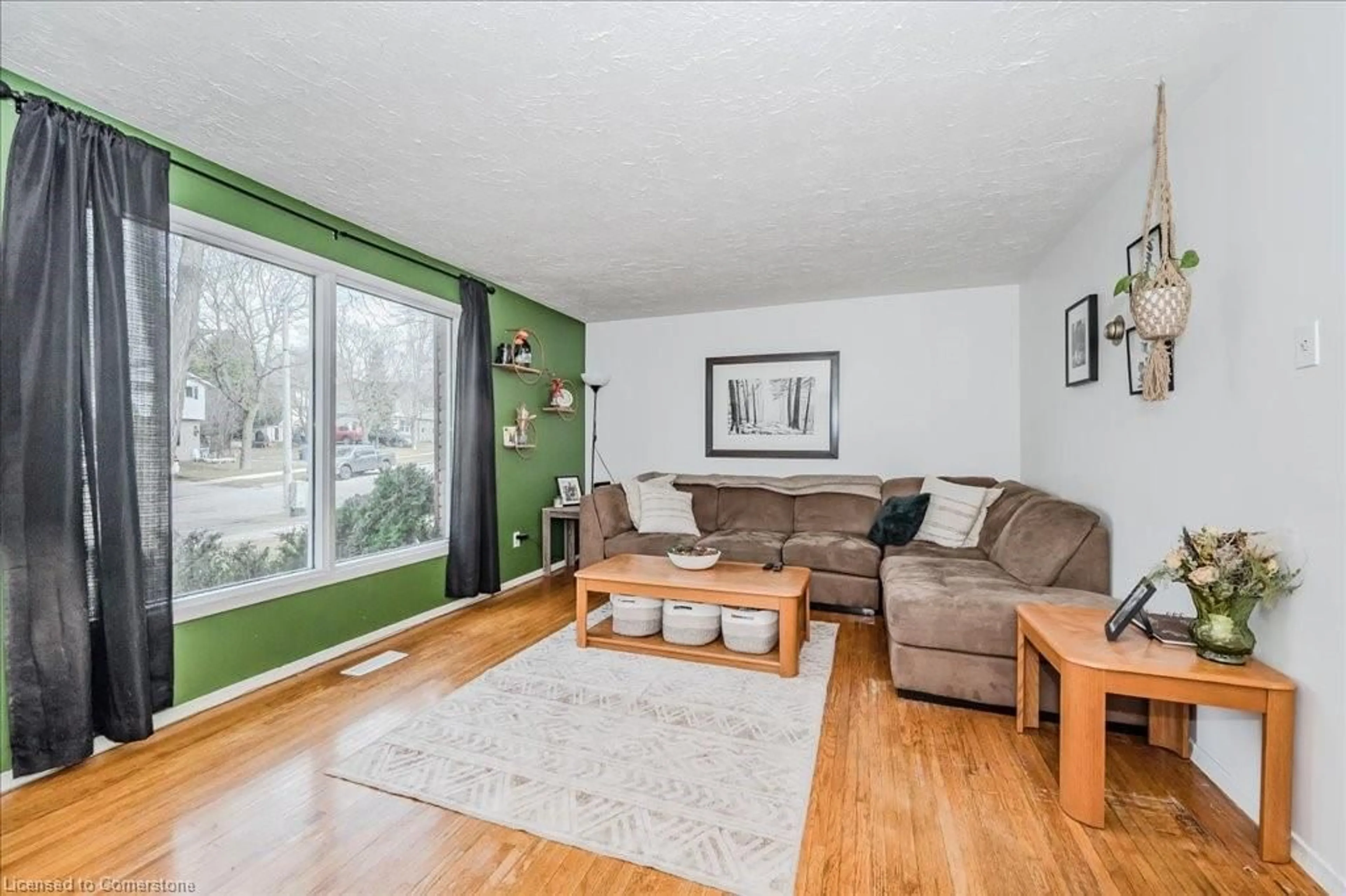 Living room with furniture, wood/laminate floor for 341 Cole Rd, Guelph Ontario N1G 3G7