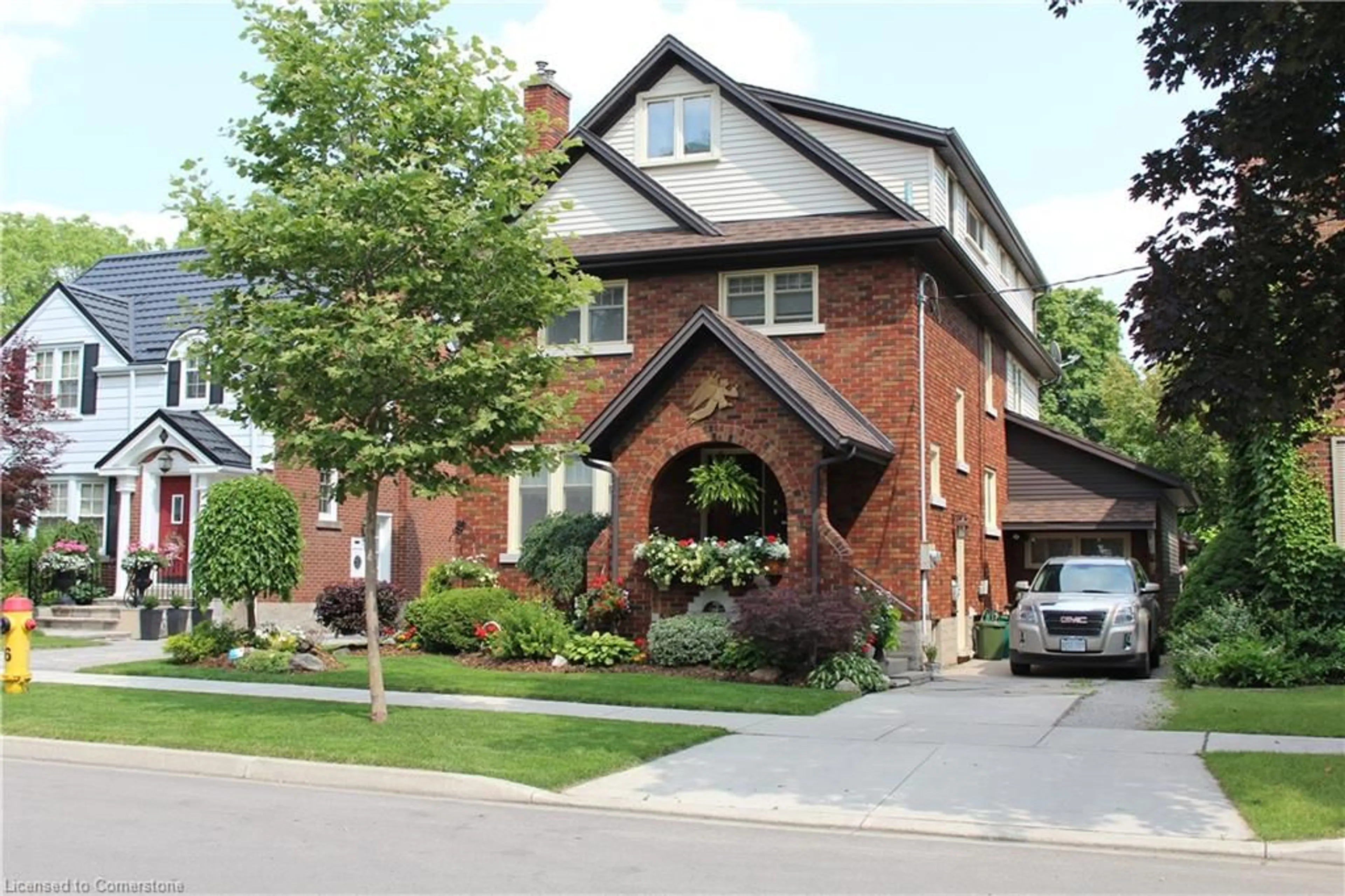 Home with brick exterior material, street for 77 Borden Ave, Kitchener Ontario N2H 3J2