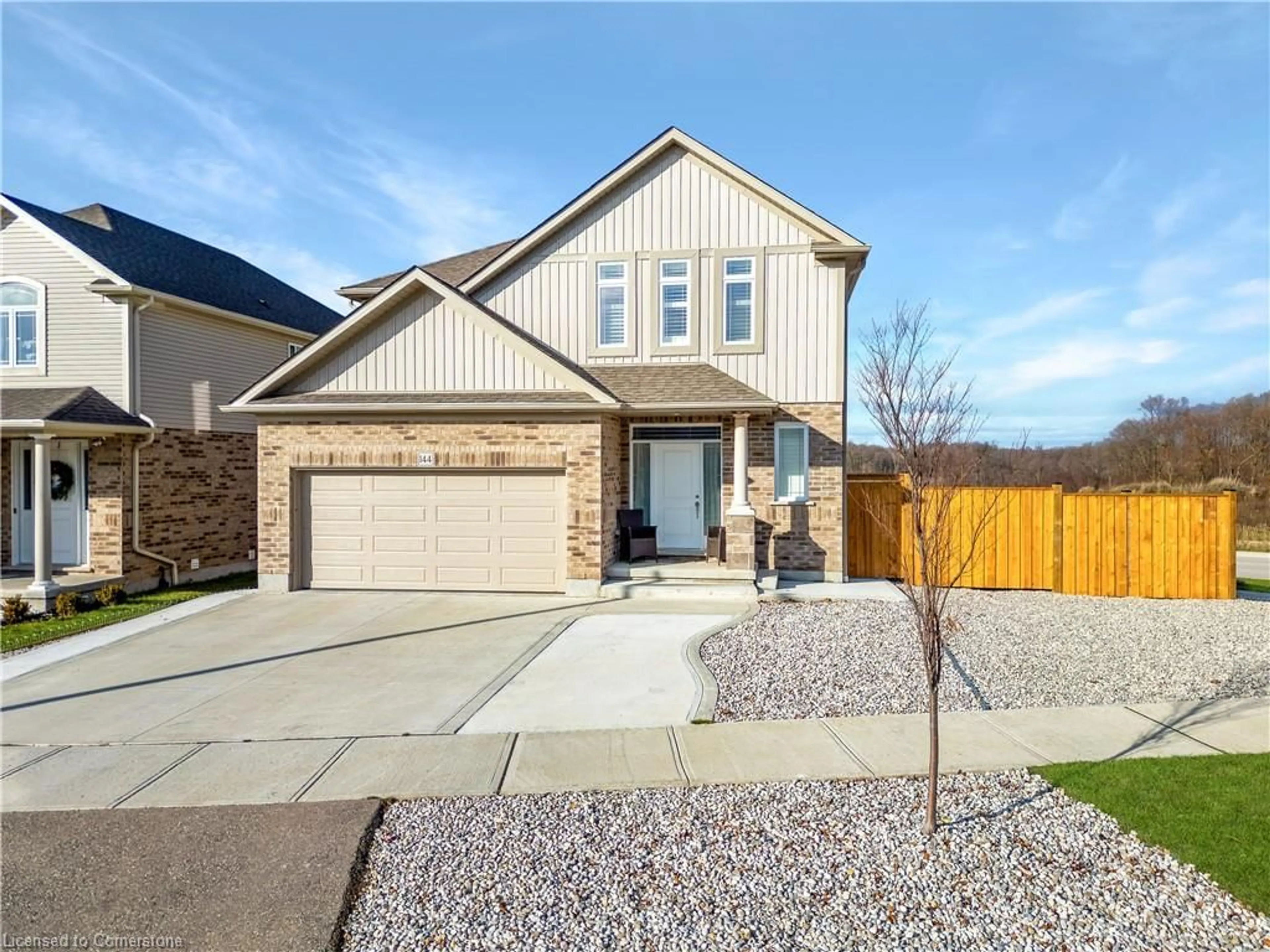 Home with brick exterior material, street for 144 Cinnamon Fern St, Waterloo Ontario N2V 0E9