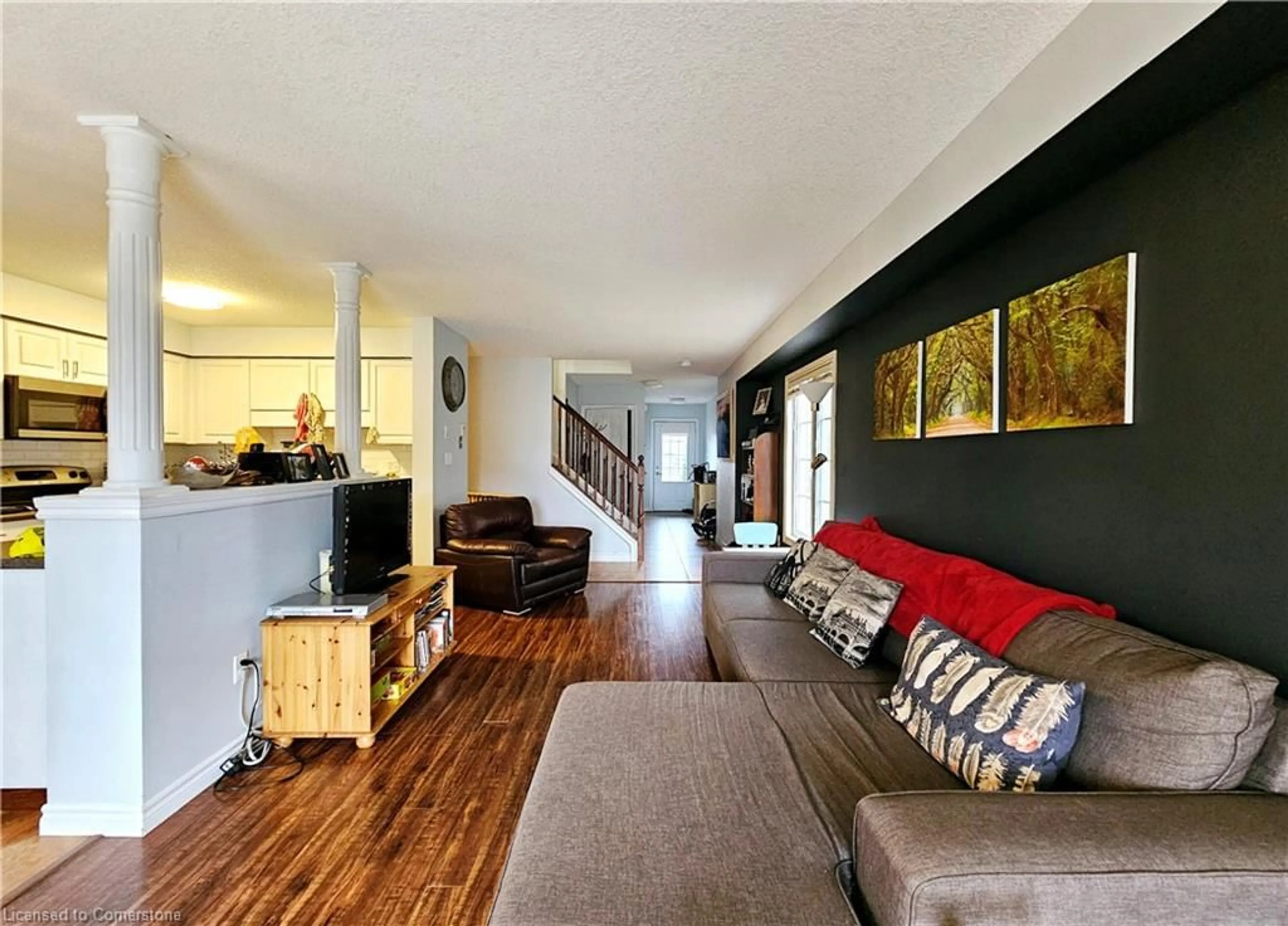 Living room with furniture, wood/laminate floor for 299 Old Huron Rd, Kitchener Ontario N2R 0A3