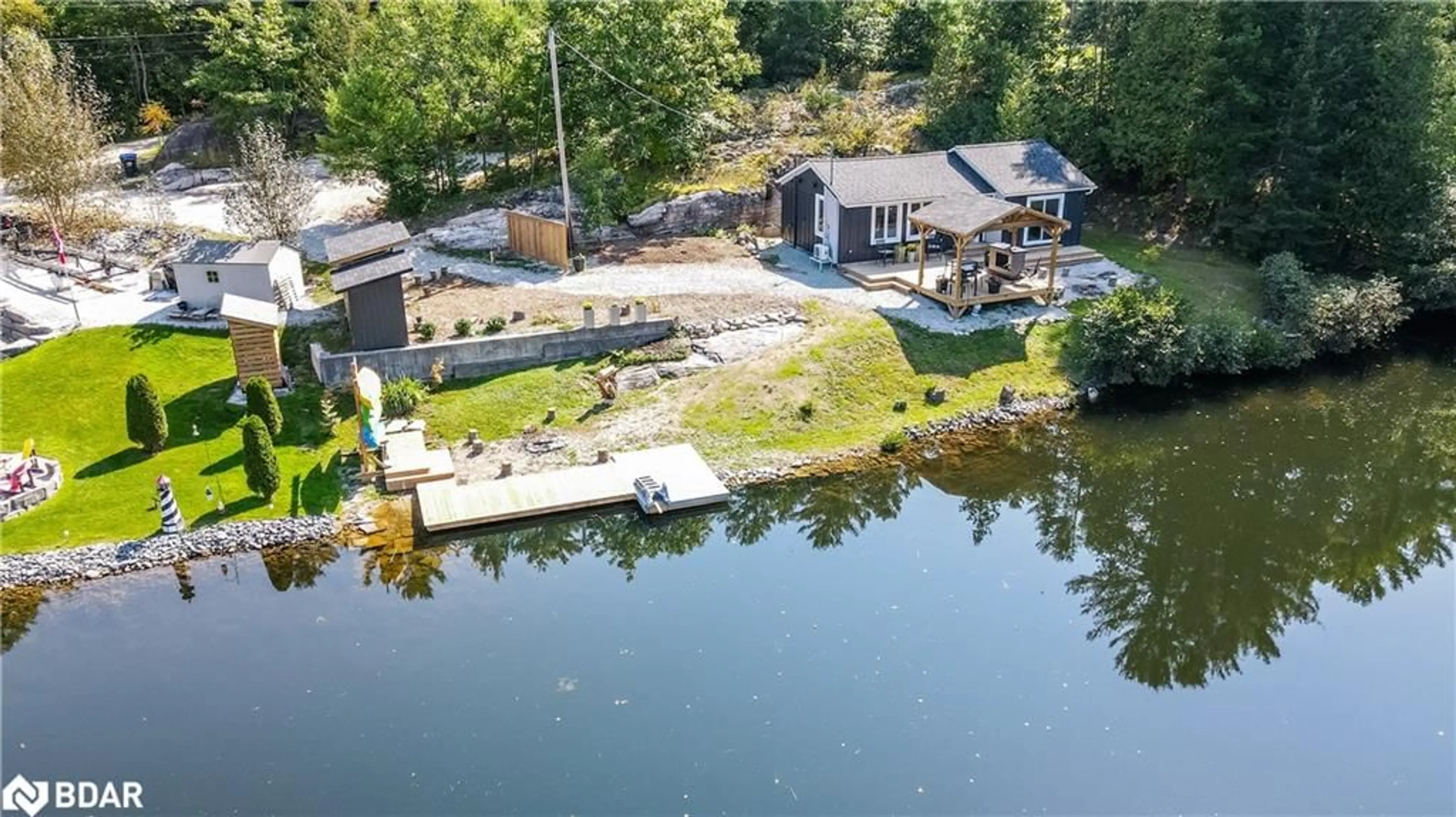 A pic from outside/outdoor area/front of a property/back of a property/a pic from drone, water/lake/river/ocean view for 8150 Laidlaw Ave, Washago Ontario L0K 2B0