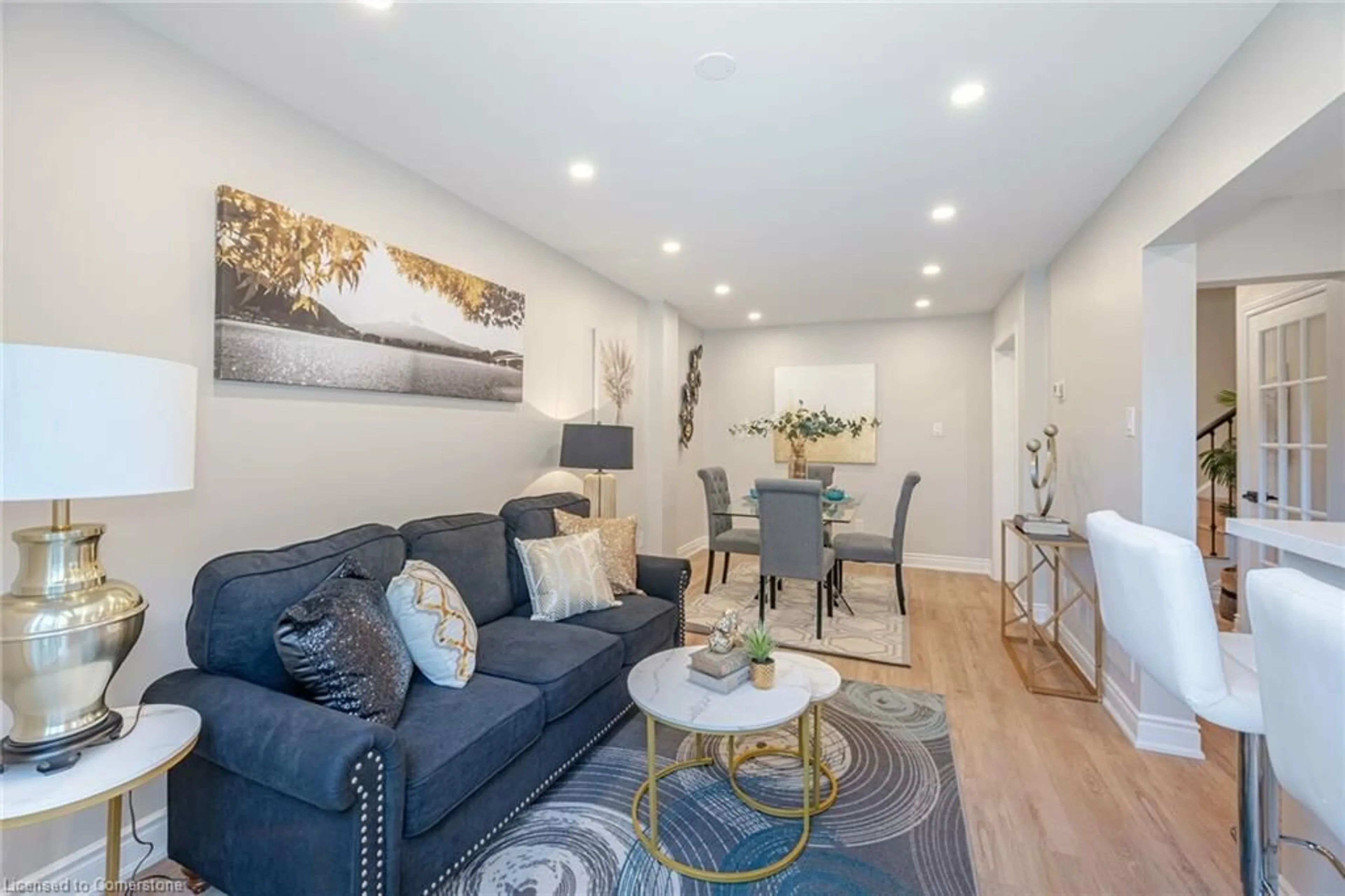 Living room with furniture, wood/laminate floor for 5659 Glen Erin Dr #58, Mississauga Ontario L5M 5P2