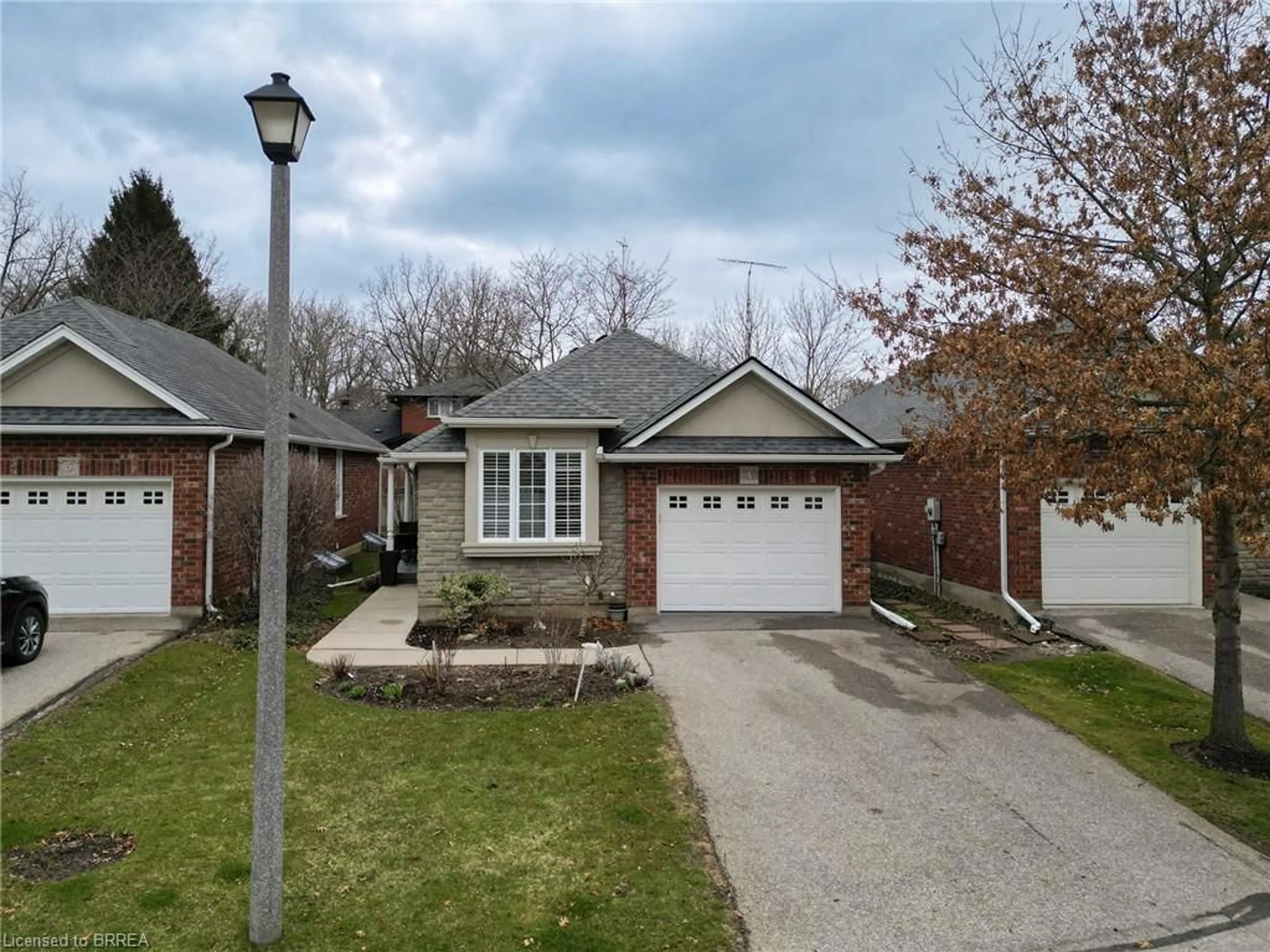 Home with brick exterior material, street for 115 Glenwood Dr #4, Brantford Ontario N3S 3G8