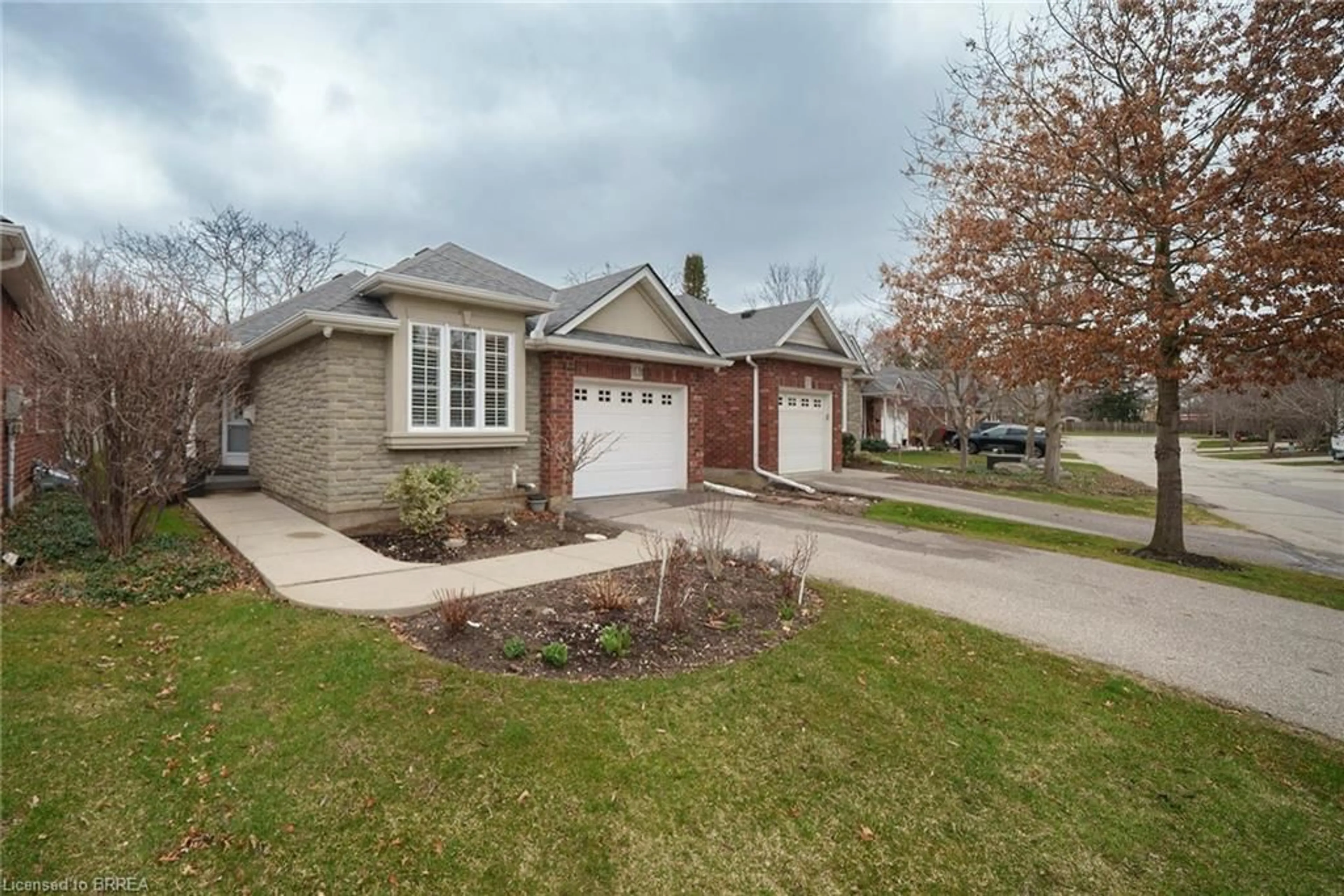 Home with brick exterior material, street for 115 Glenwood Dr #4, Brantford Ontario N3S 3G8