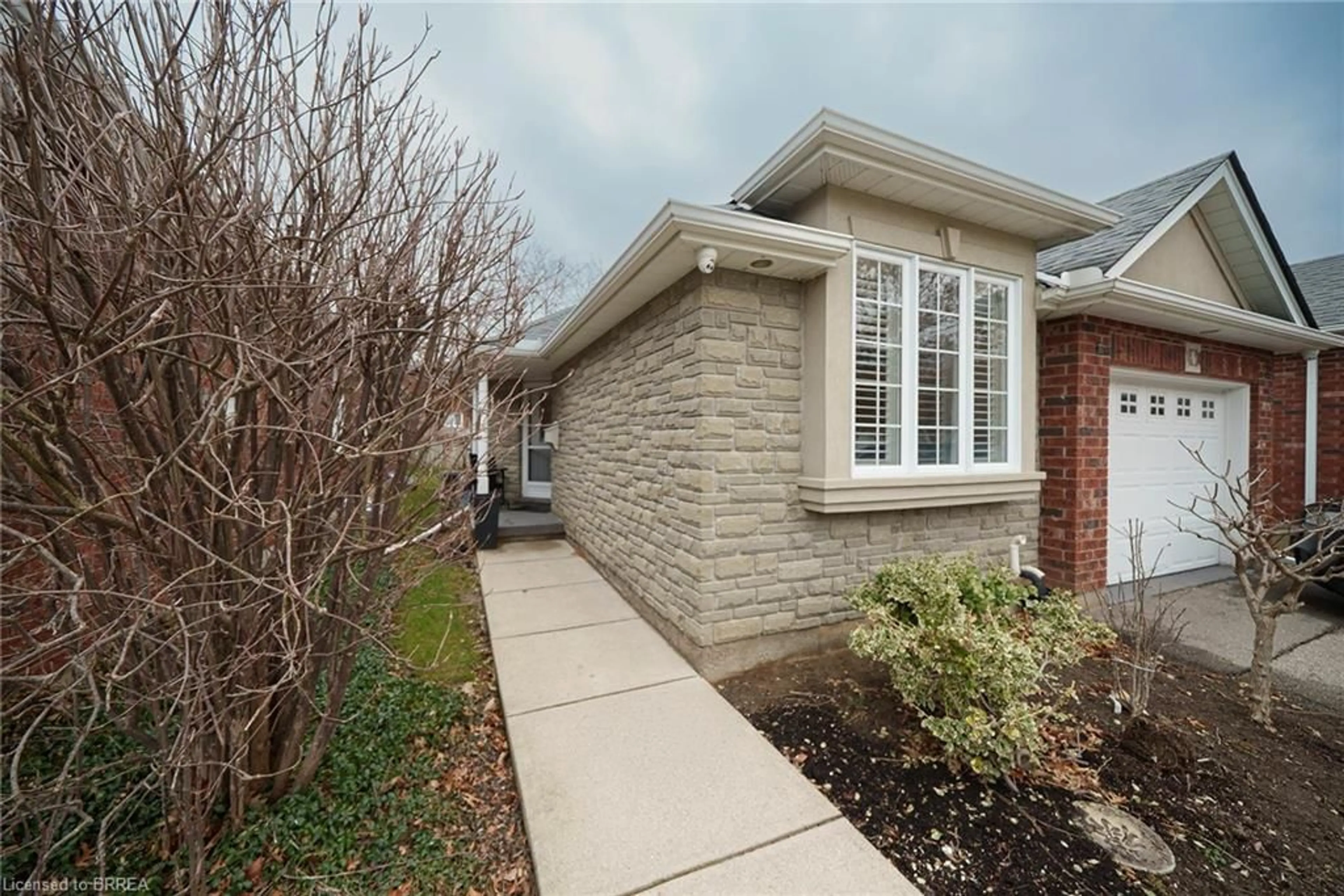 Home with brick exterior material, street for 115 Glenwood Dr #4, Brantford Ontario N3S 3G8