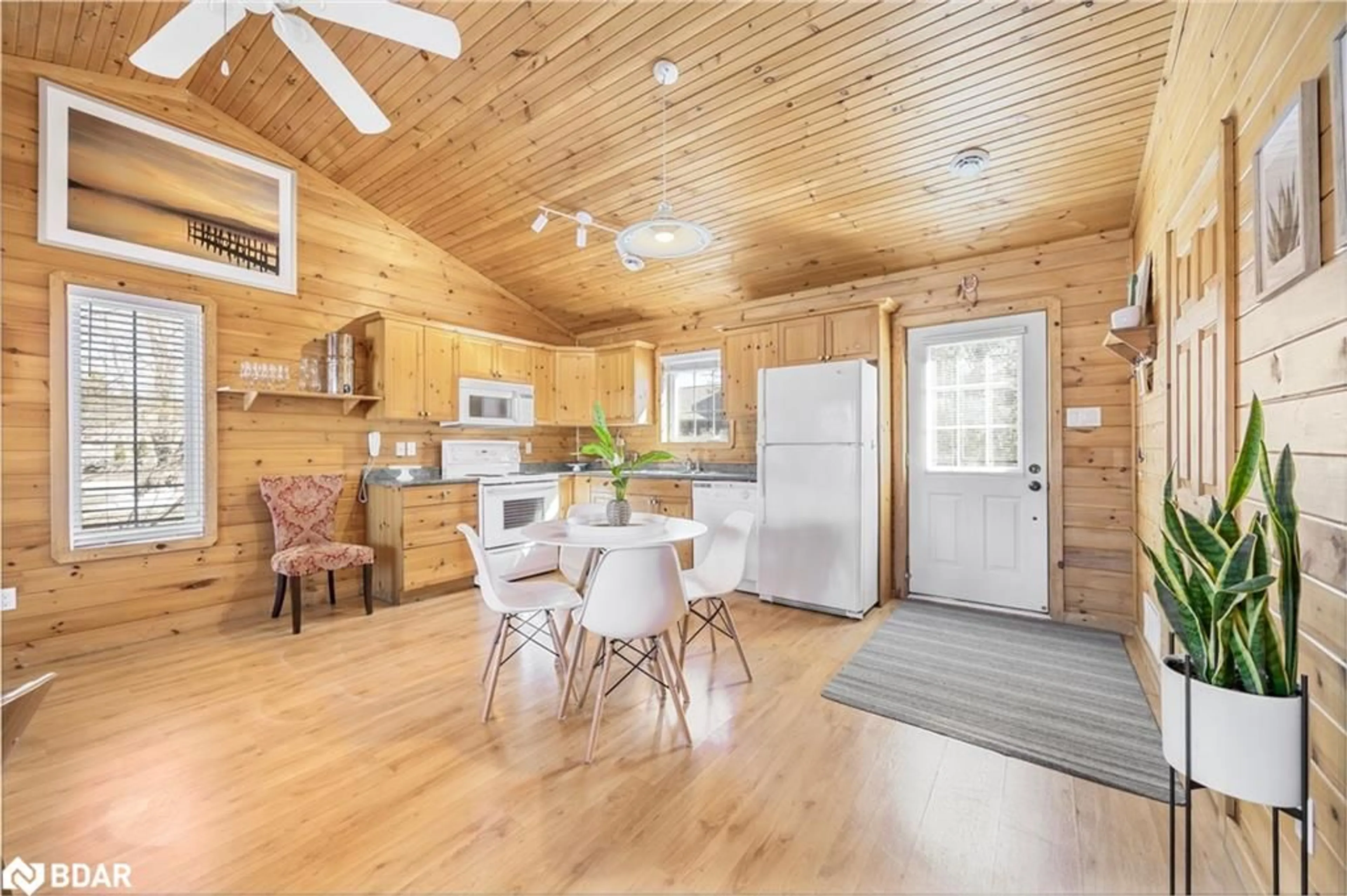 Open concept kitchen, wood/laminate floor for 26 Cabin Cres, Wasaga Beach Ontario L9Z 1X7