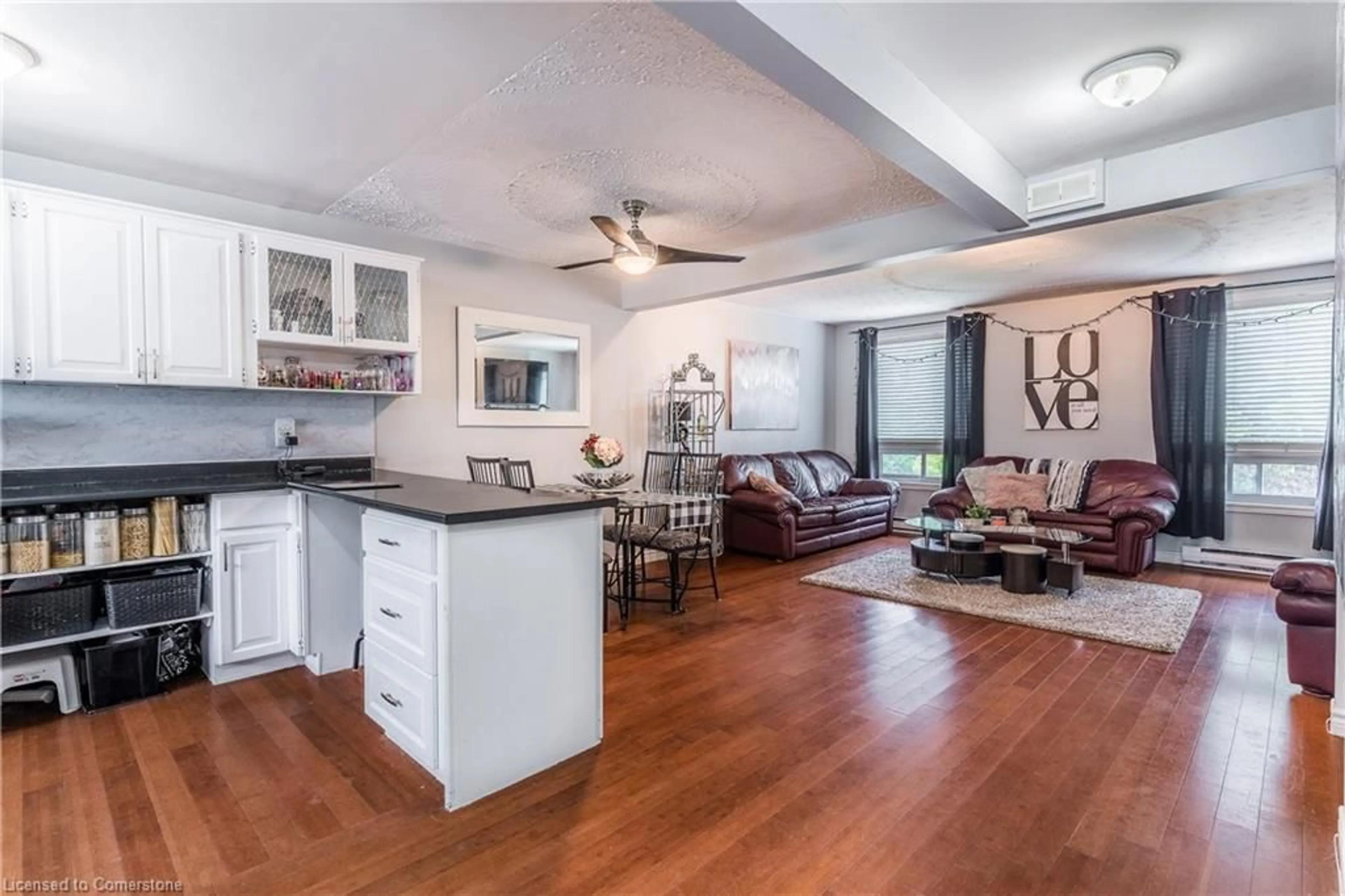 Open concept kitchen, wood/laminate floor for 628 Wilkins St, London Ontario N6C 4Z4