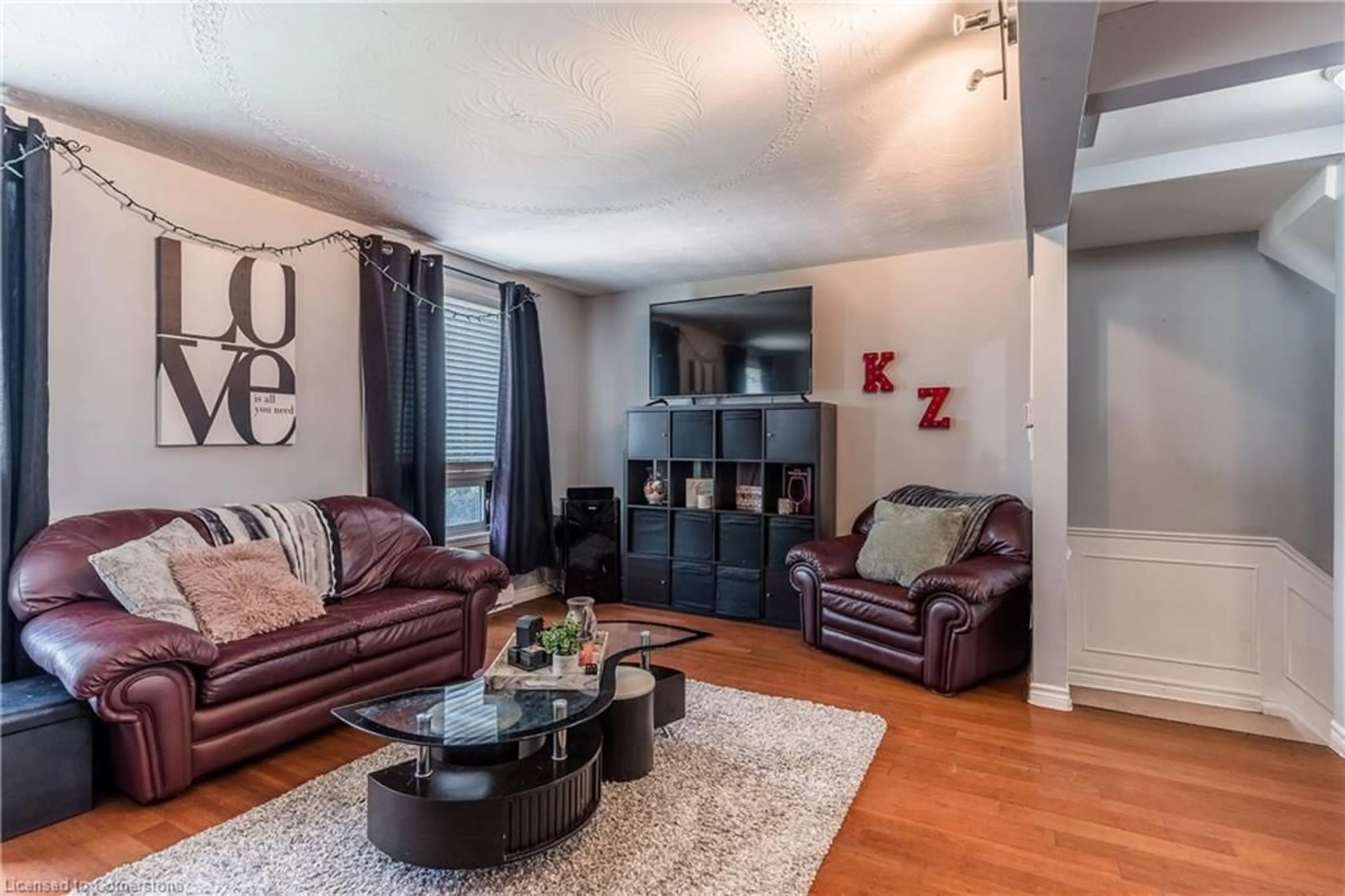 Living room with furniture, wood/laminate floor for 628 Wilkins St, London Ontario N6C 4Z4
