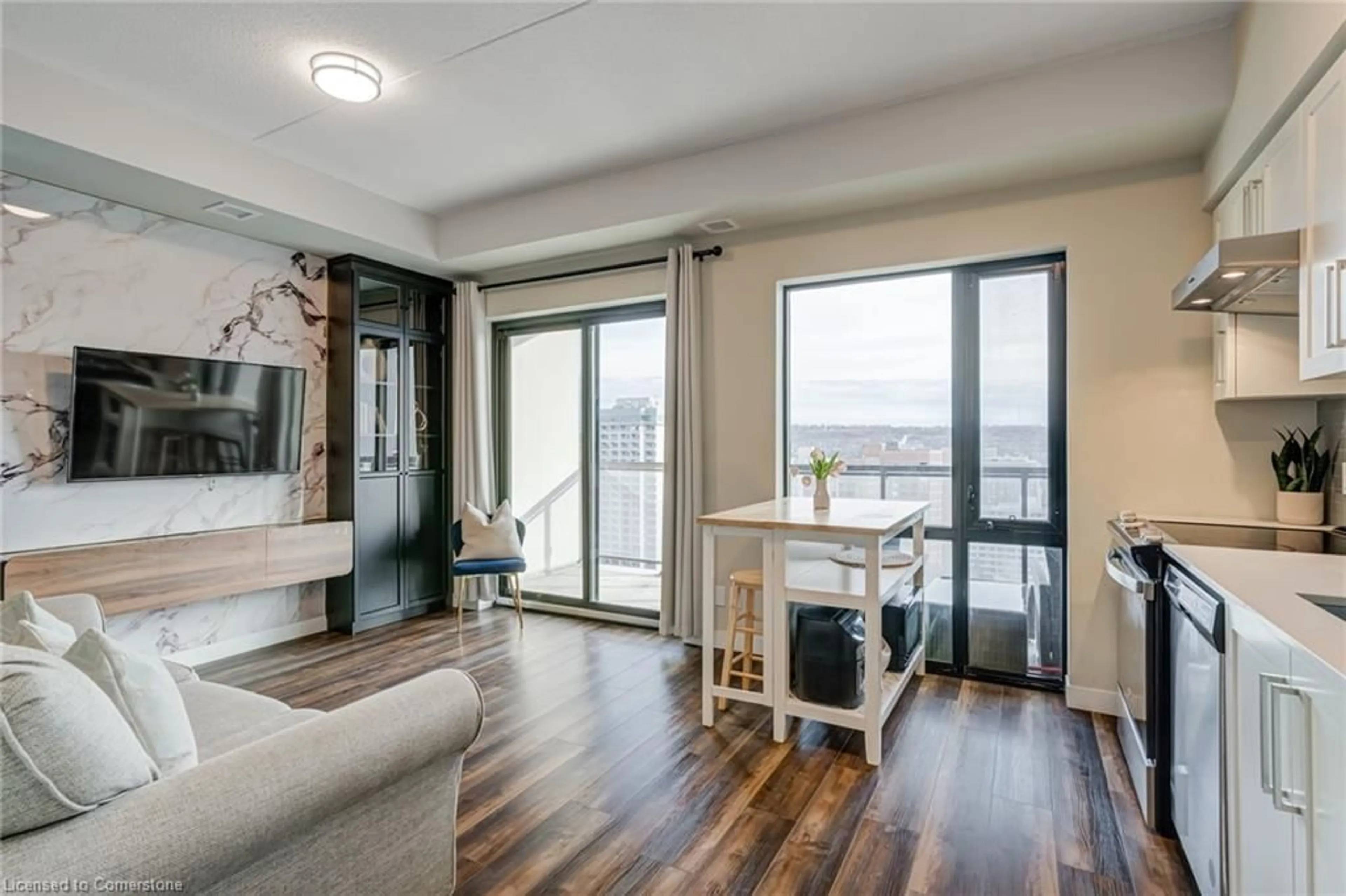 Living room with furniture, wood/laminate floor for 15 Queen St #1701, Hamilton Ontario L8P 3R4