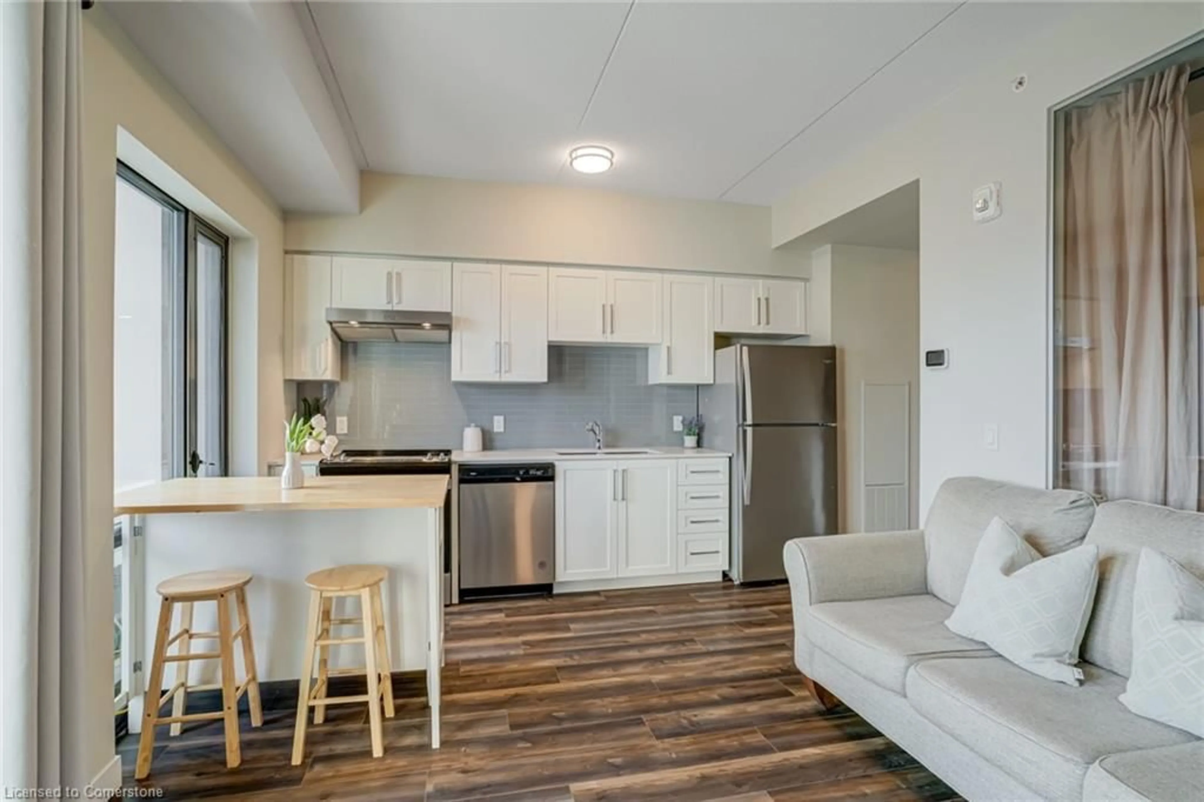 Open concept kitchen, wood/laminate floor for 15 Queen St #1701, Hamilton Ontario L8P 3R4