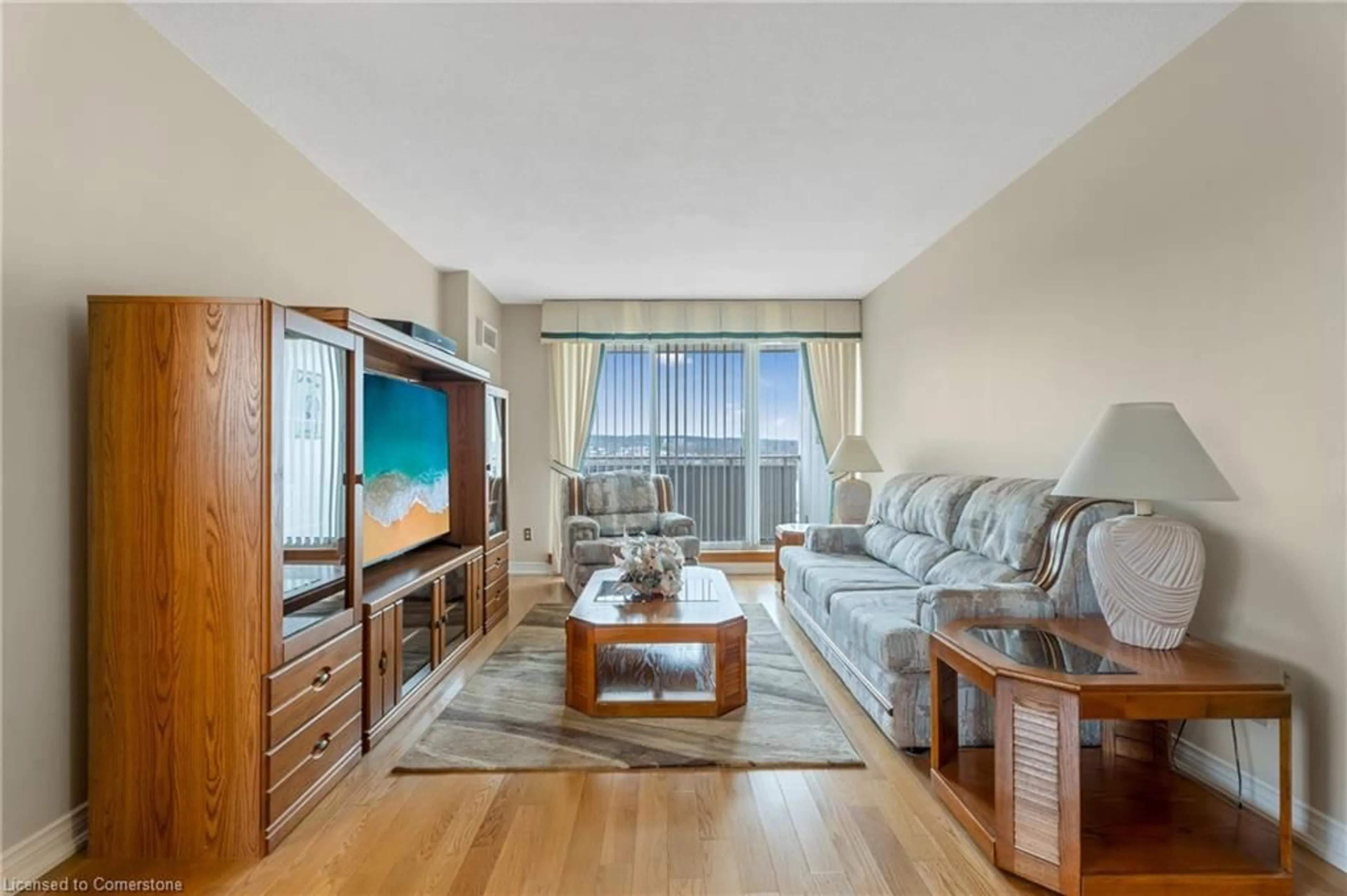 Living room with furniture, wood/laminate floor for 1425 Ghent Ave #907, Burlington Ontario L7S 1X5