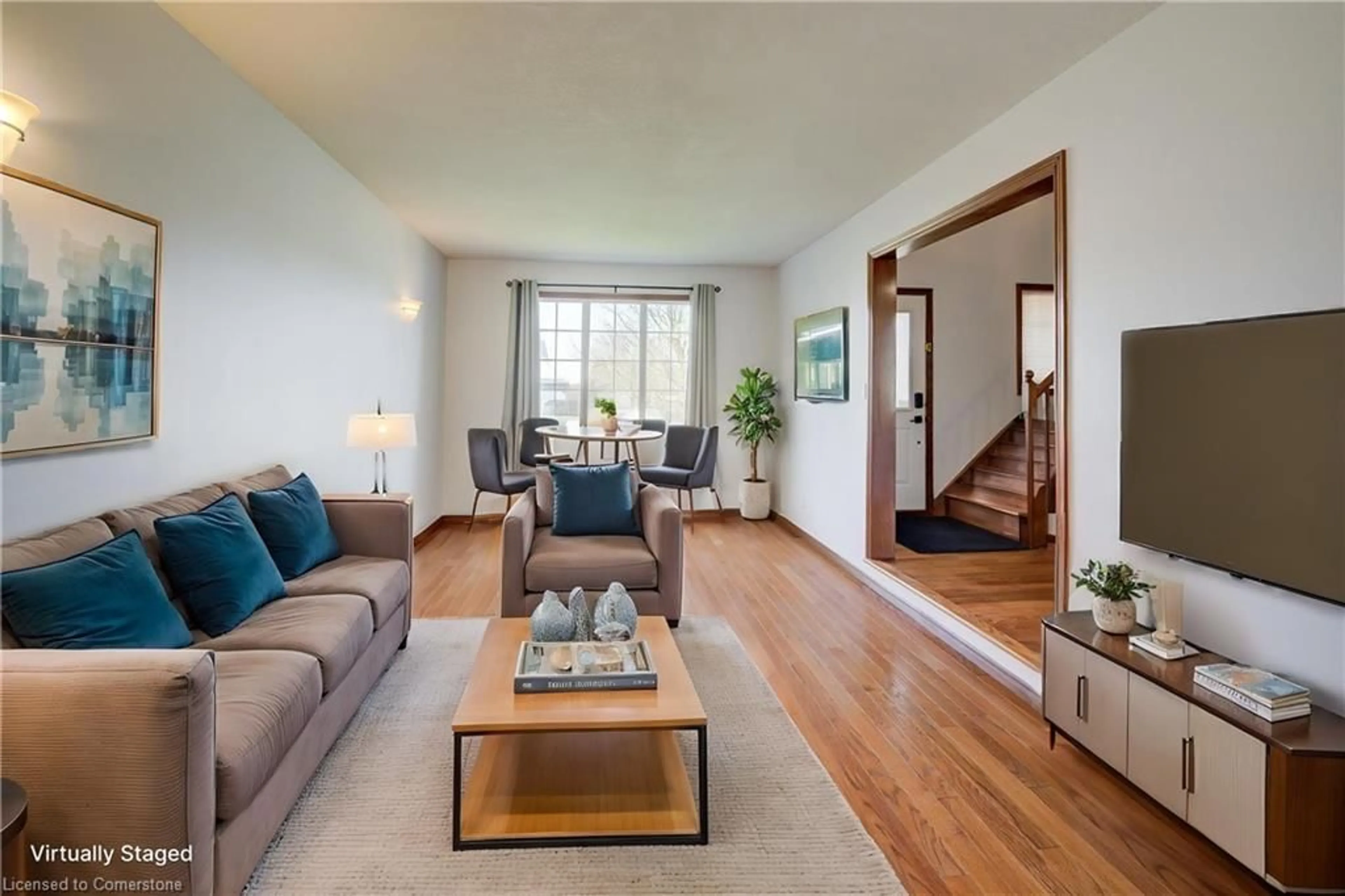 Living room with furniture, wood/laminate floor for 115 Nathan Crt, Cambridge Ontario N1P 1C1