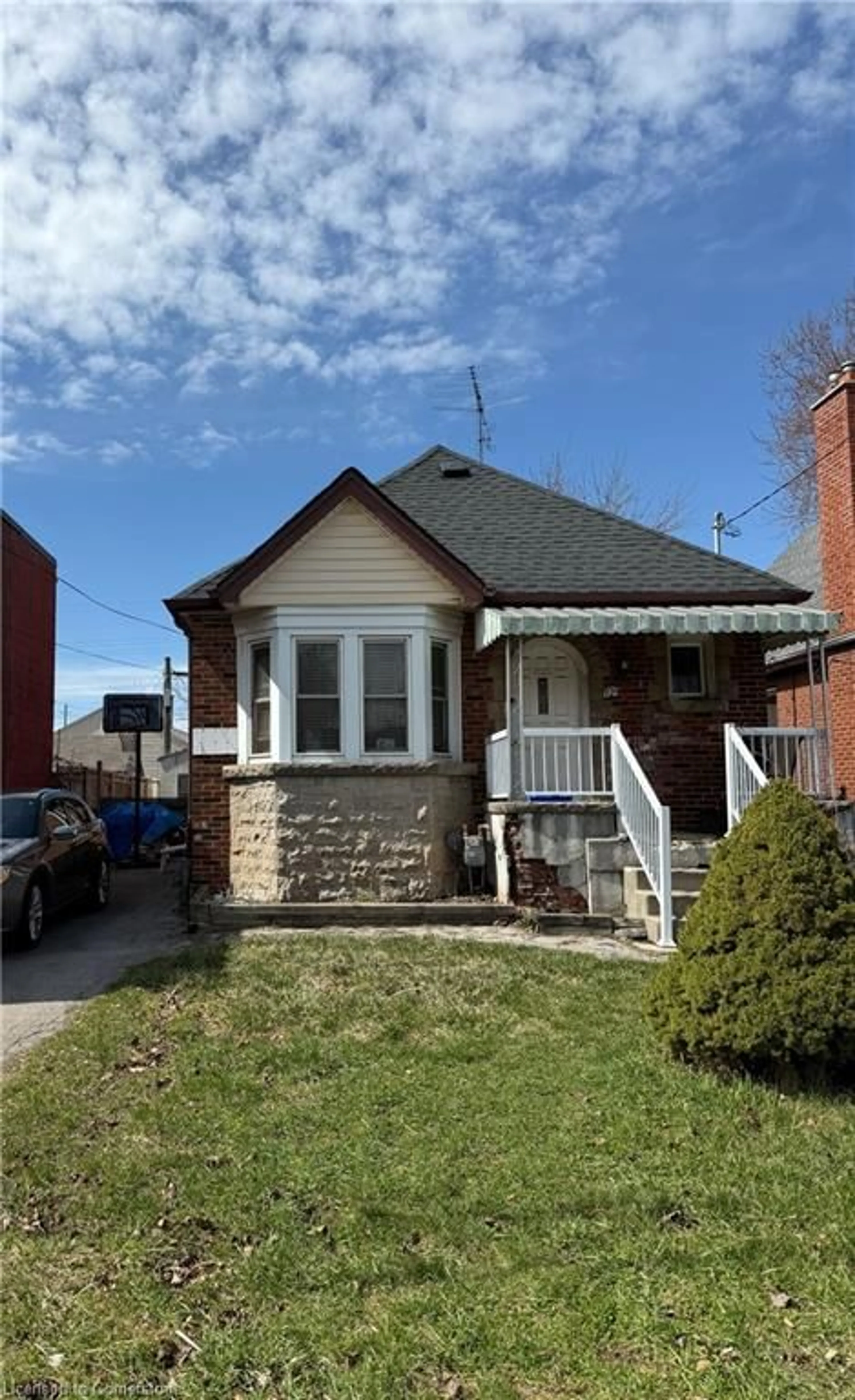 Home with brick exterior material, street for 129 Tolton Ave, Hamilton Ontario L8H 5N9