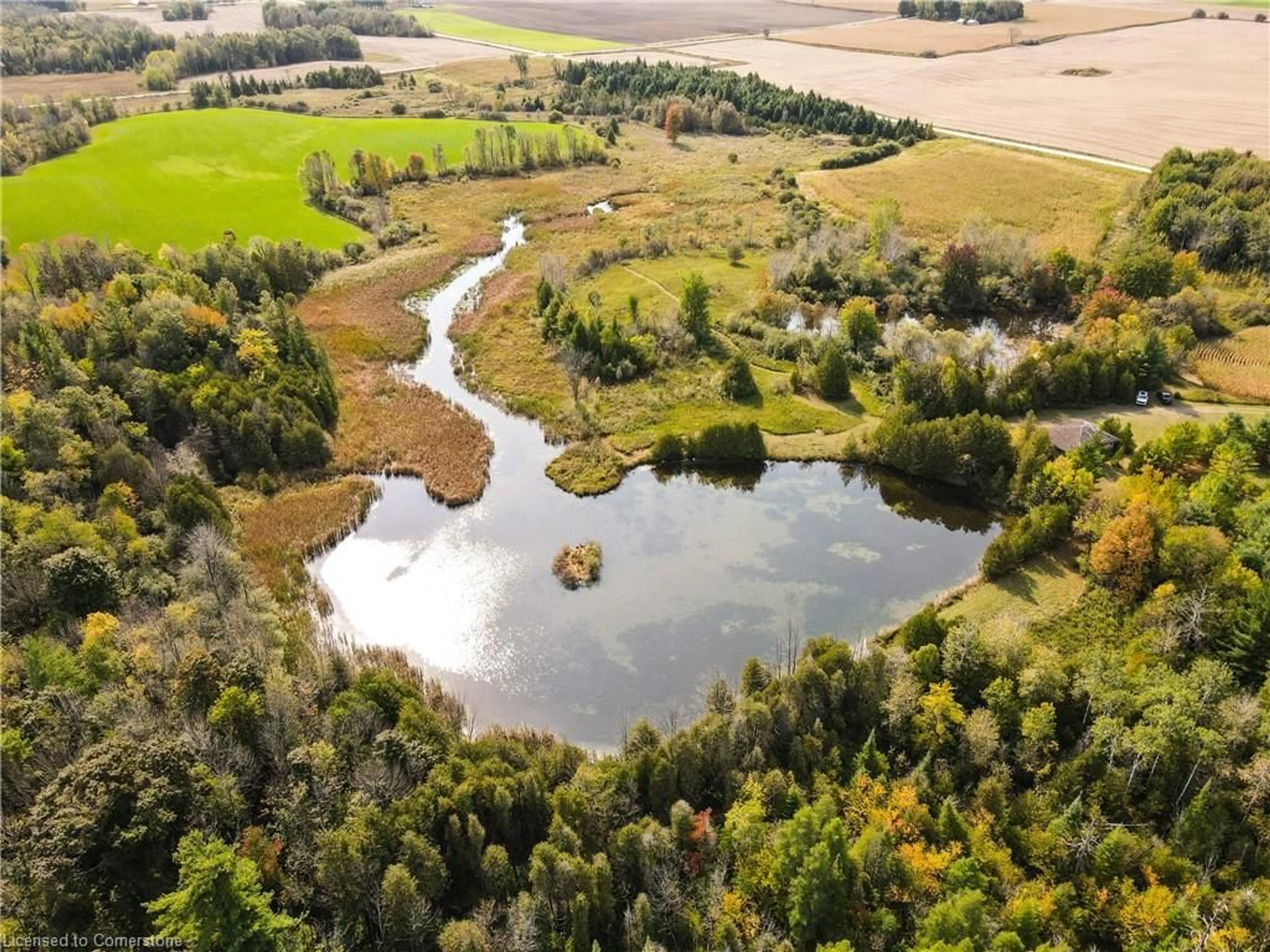 A pic from outside/outdoor area/front of a property/back of a property/a pic from drone, water/lake/river/ocean view for 89706 Malcolm Line, Clifford Ontario N0G 1M0