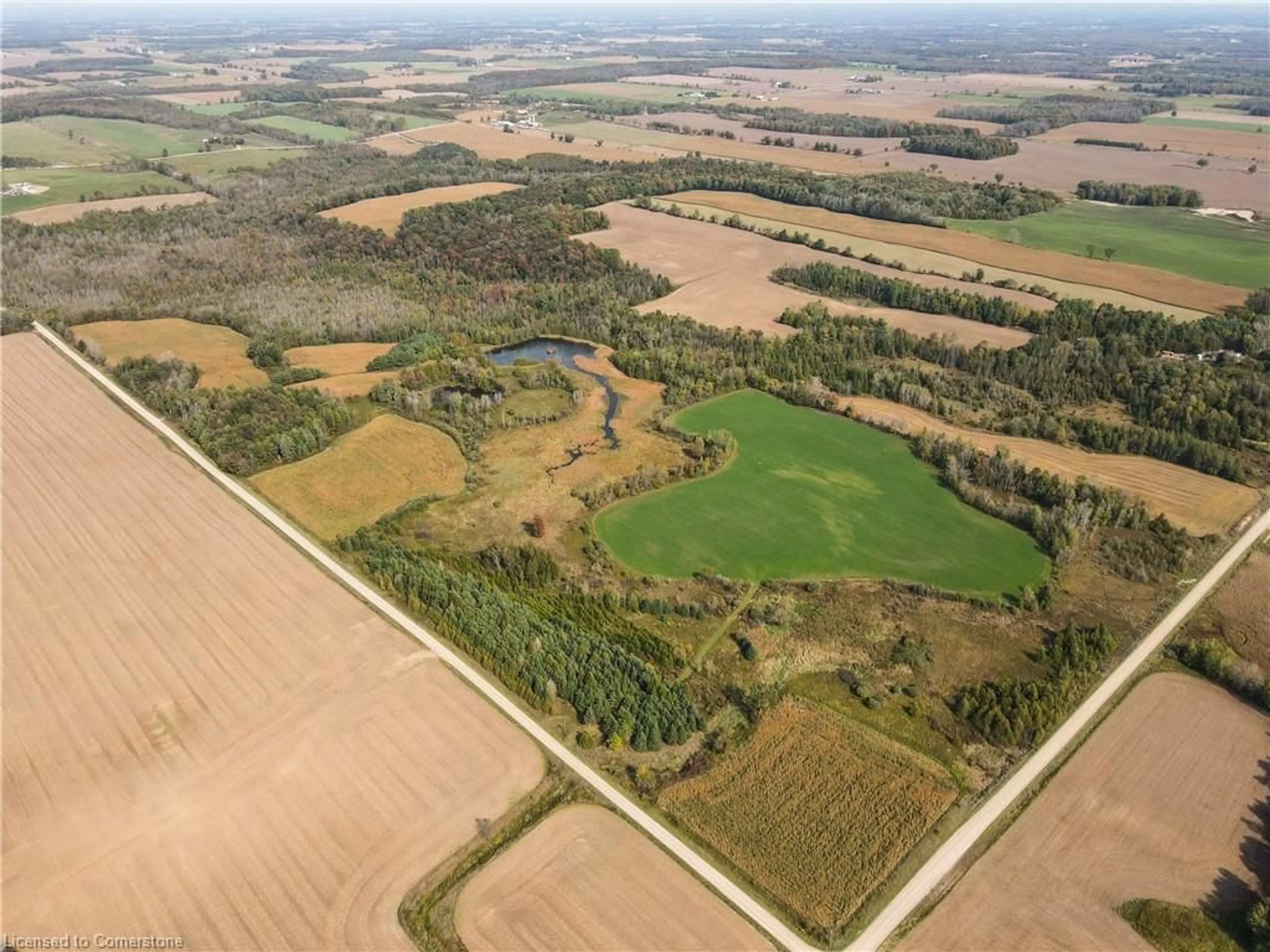 A pic from outside/outdoor area/front of a property/back of a property/a pic from drone, forest/trees view for 89706 Malcolm Line, Clifford Ontario N0G 1M0