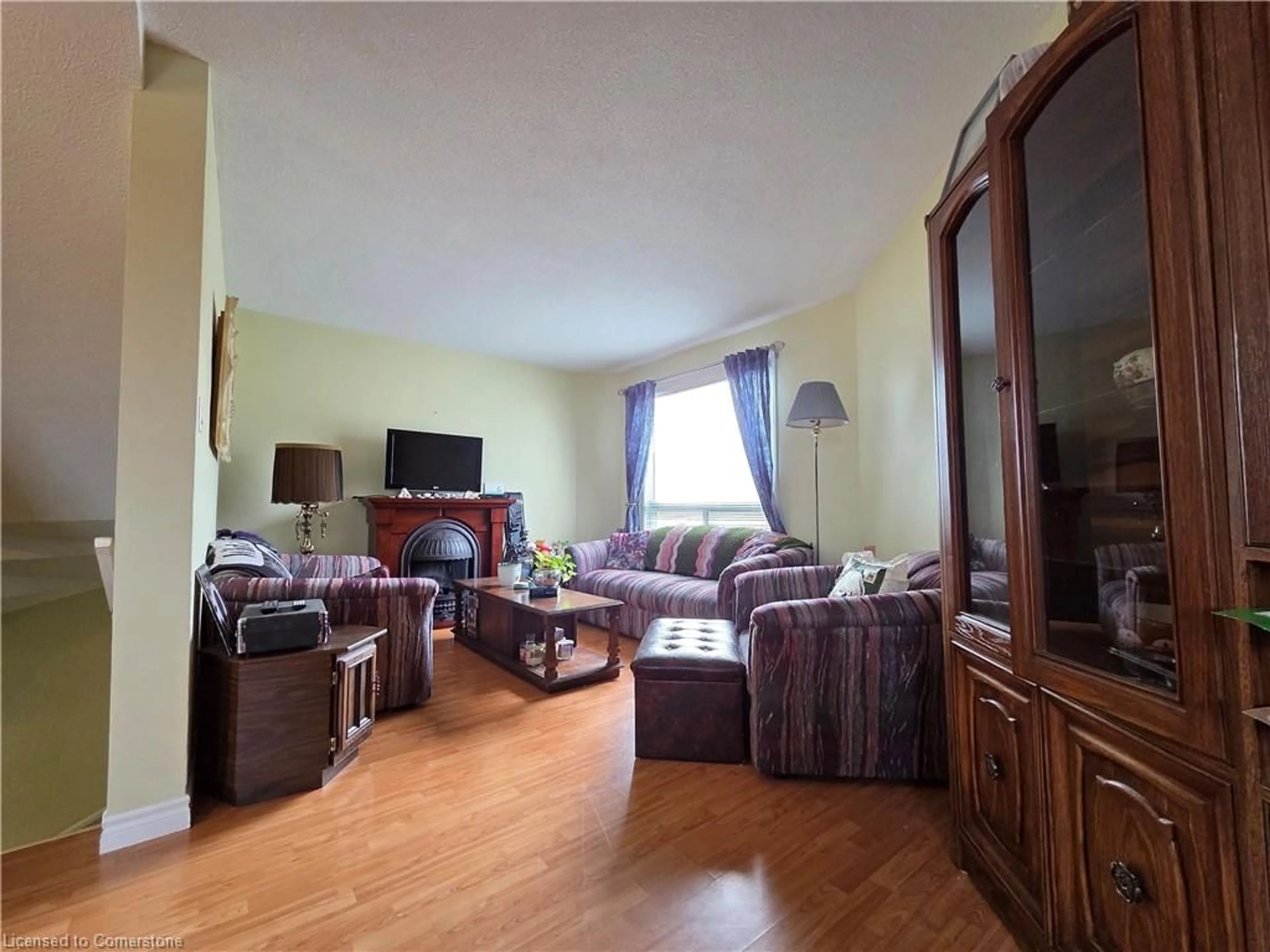 Living room with furniture, wood/laminate floor for 60 Elmsdale Dr #9, Kitchener Ontario N2E 2G4