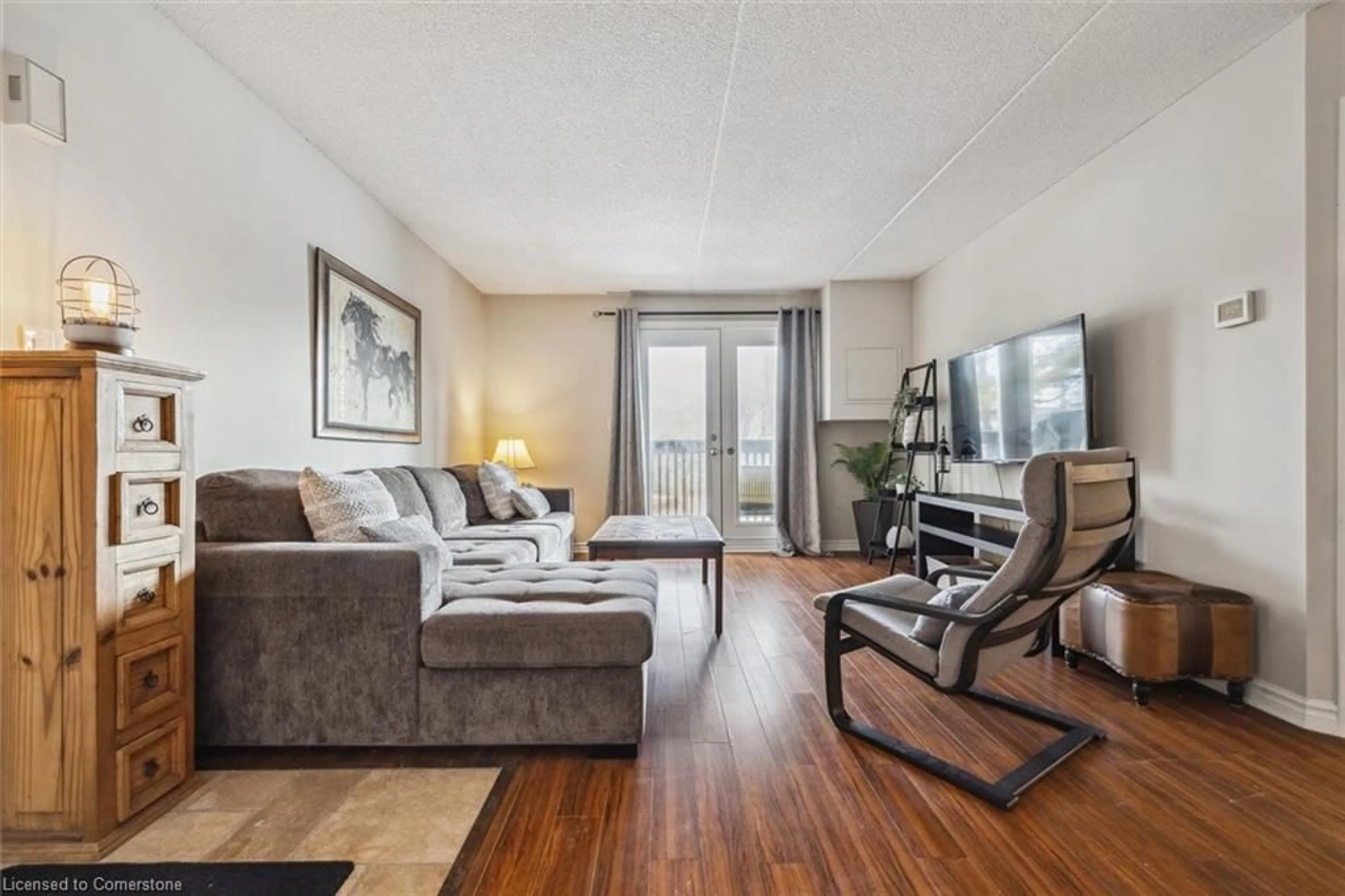 Living room with furniture, wood/laminate floor for 2020 Cleaver Ave #207, Burlington Ontario L7M 4C2