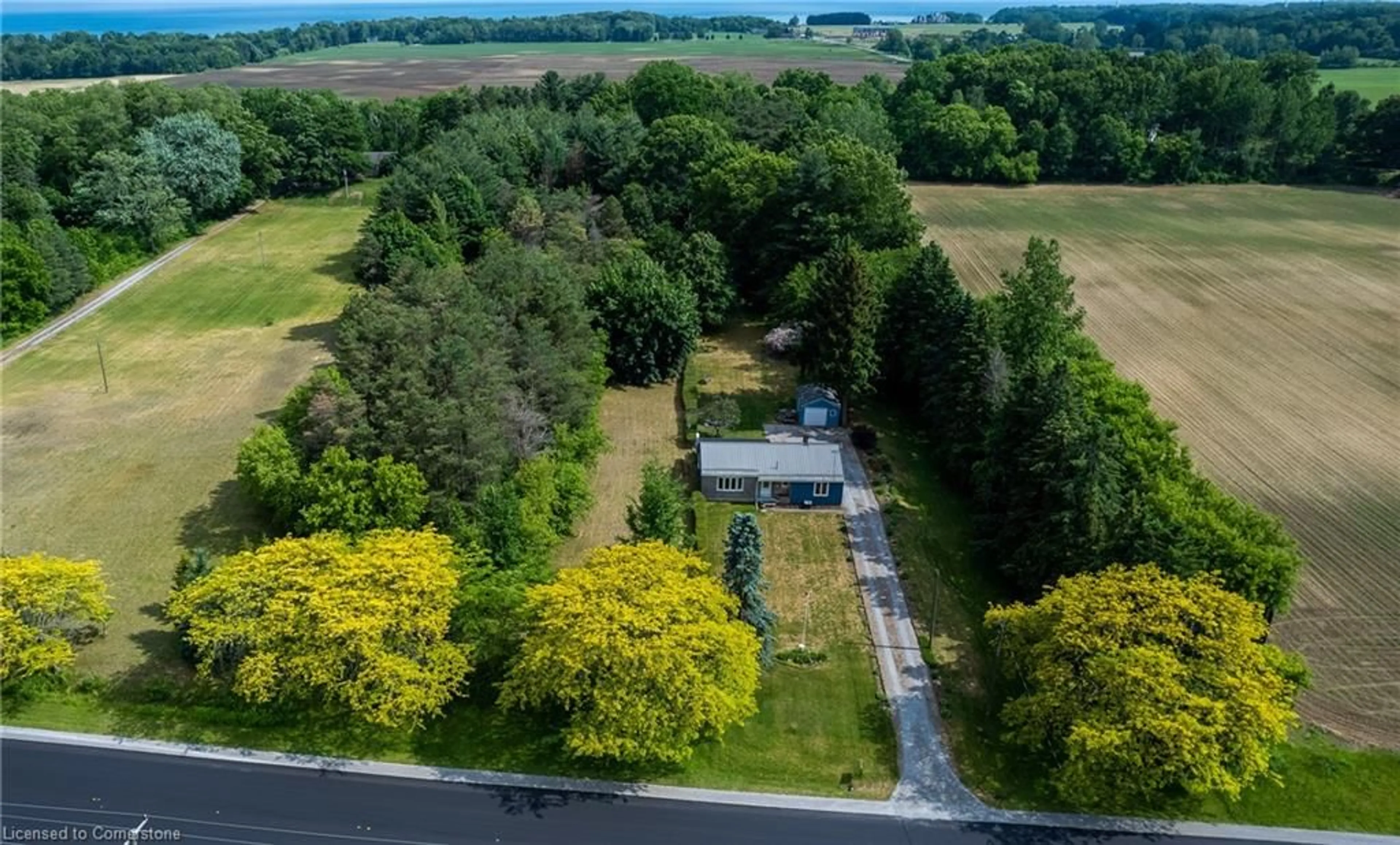 A pic from outside/outdoor area/front of a property/back of a property/a pic from drone, forest/trees view for 526 Highway 6, Port Dover Ontario N0A 1N2