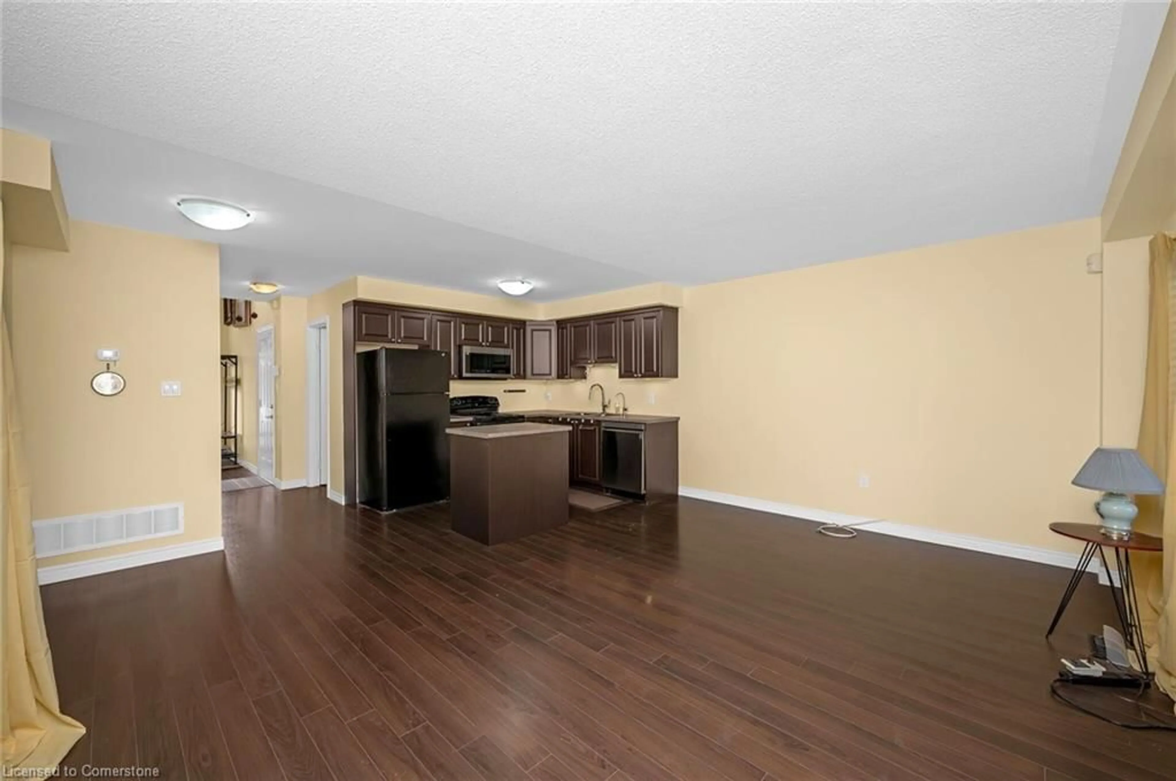 Open concept kitchen, wood/laminate floor for 20 Mcconkey Cres #90, Brantford Ontario N3S 0C1
