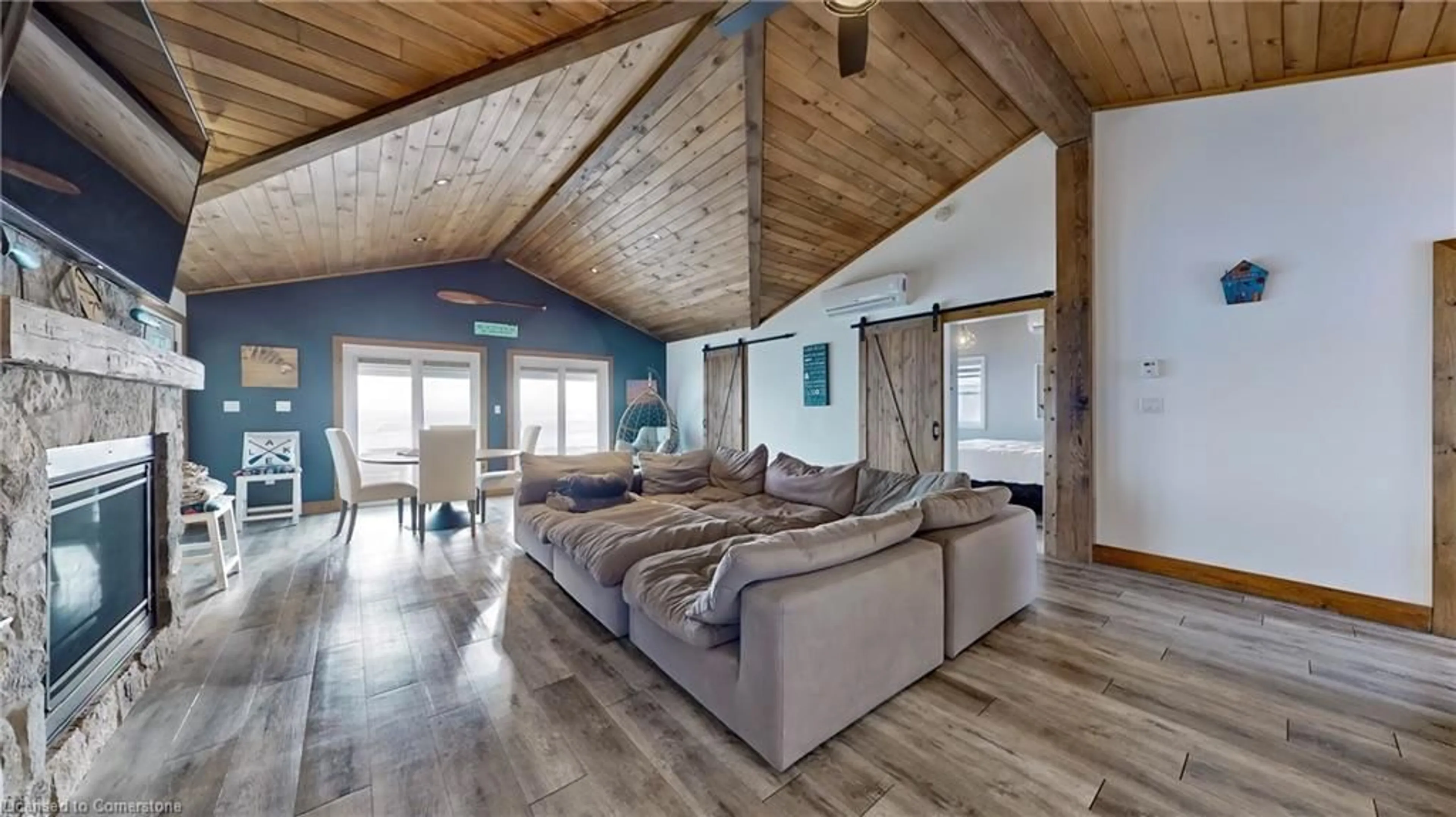 Living room with furniture, wood/laminate floor for 11495 Cook Lane, Wainfleet Ontario L0S 1V0