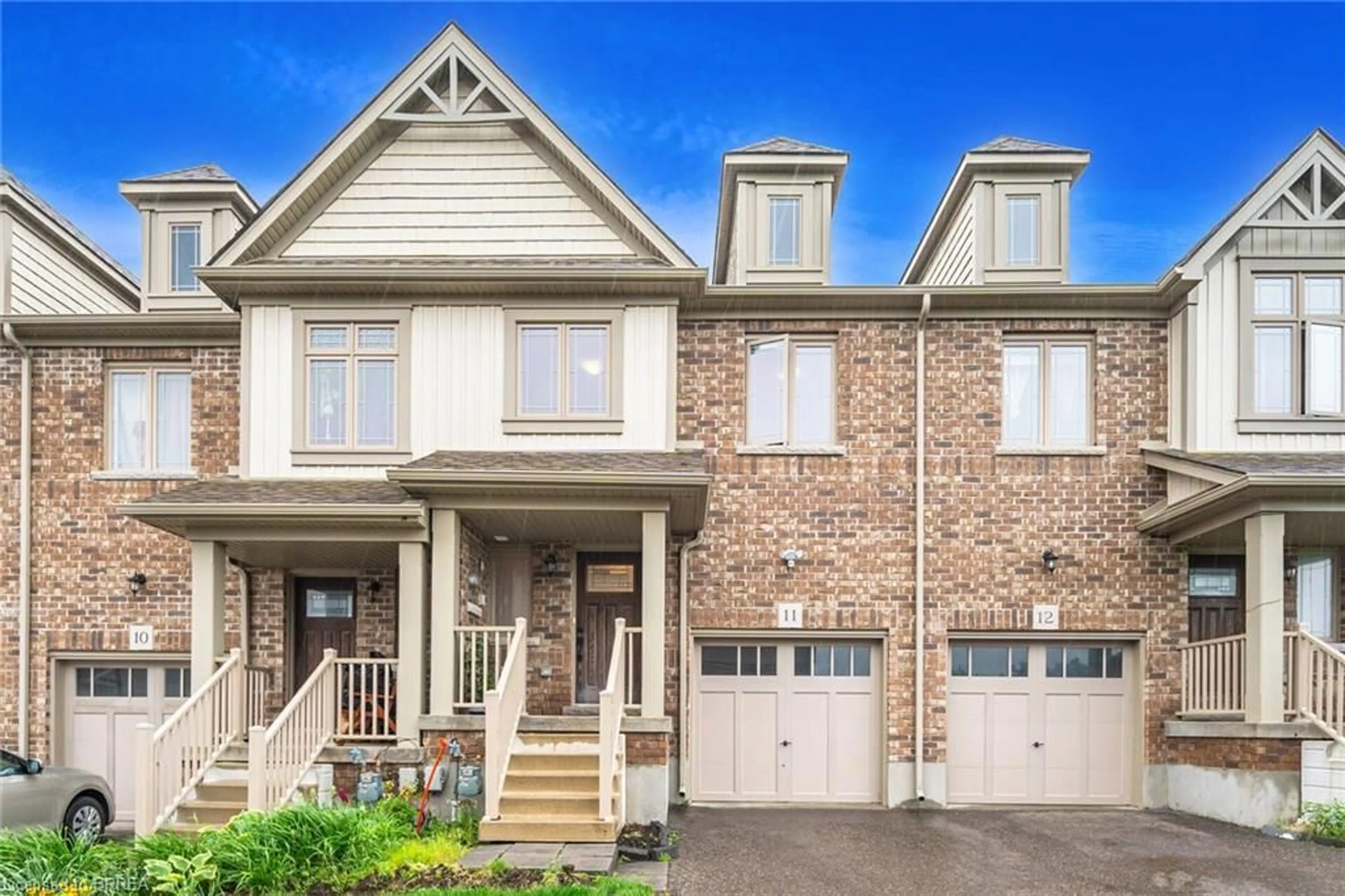 Home with brick exterior material, street for 124 Parkinson Cres #11, Orangeville Ontario L9W 6X3