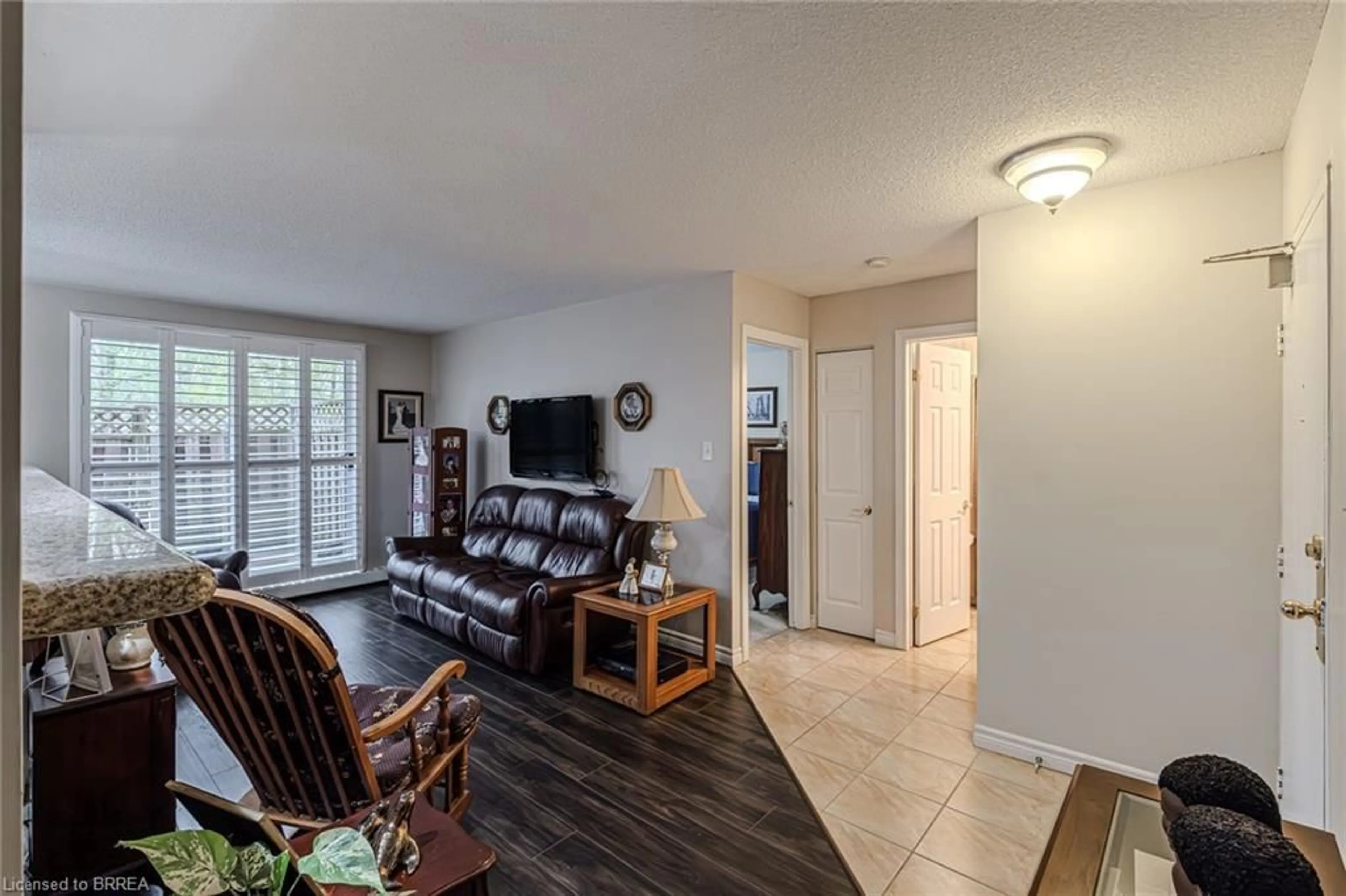 Living room with furniture, unknown for 793 Colborne St #117, Brantford Ontario N3S 7J3