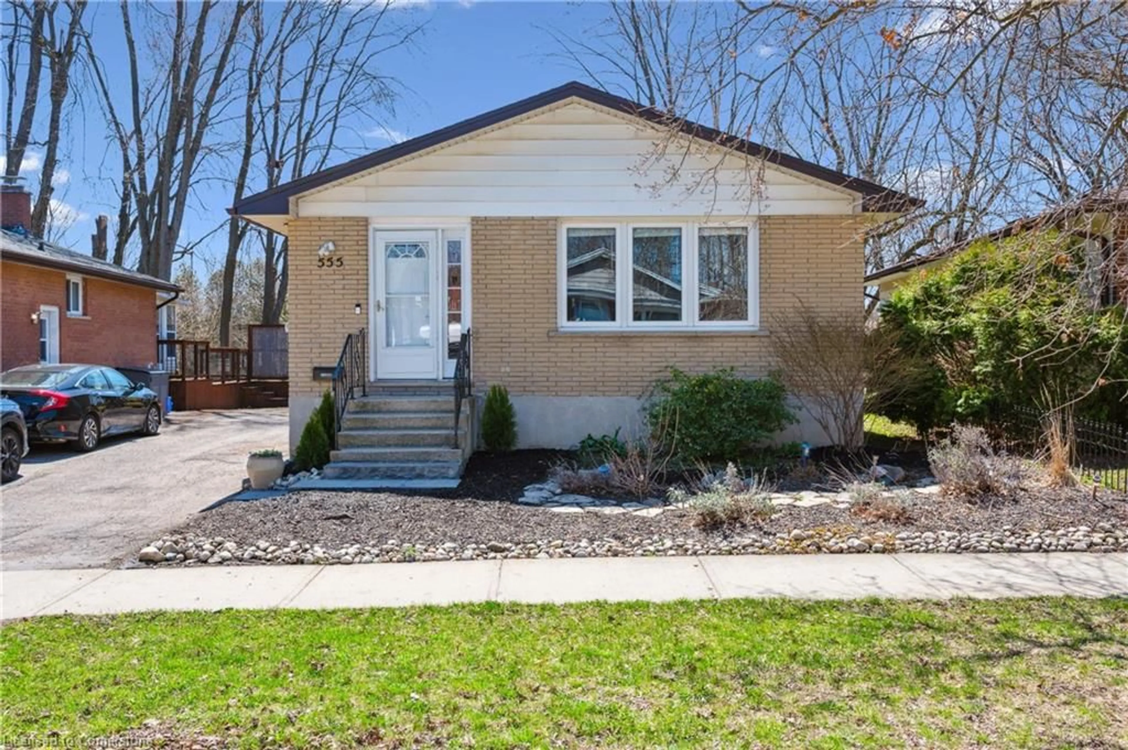 Home with vinyl exterior material, street for 555 Fallingbrook Dr, Waterloo Ontario N2L 4N2