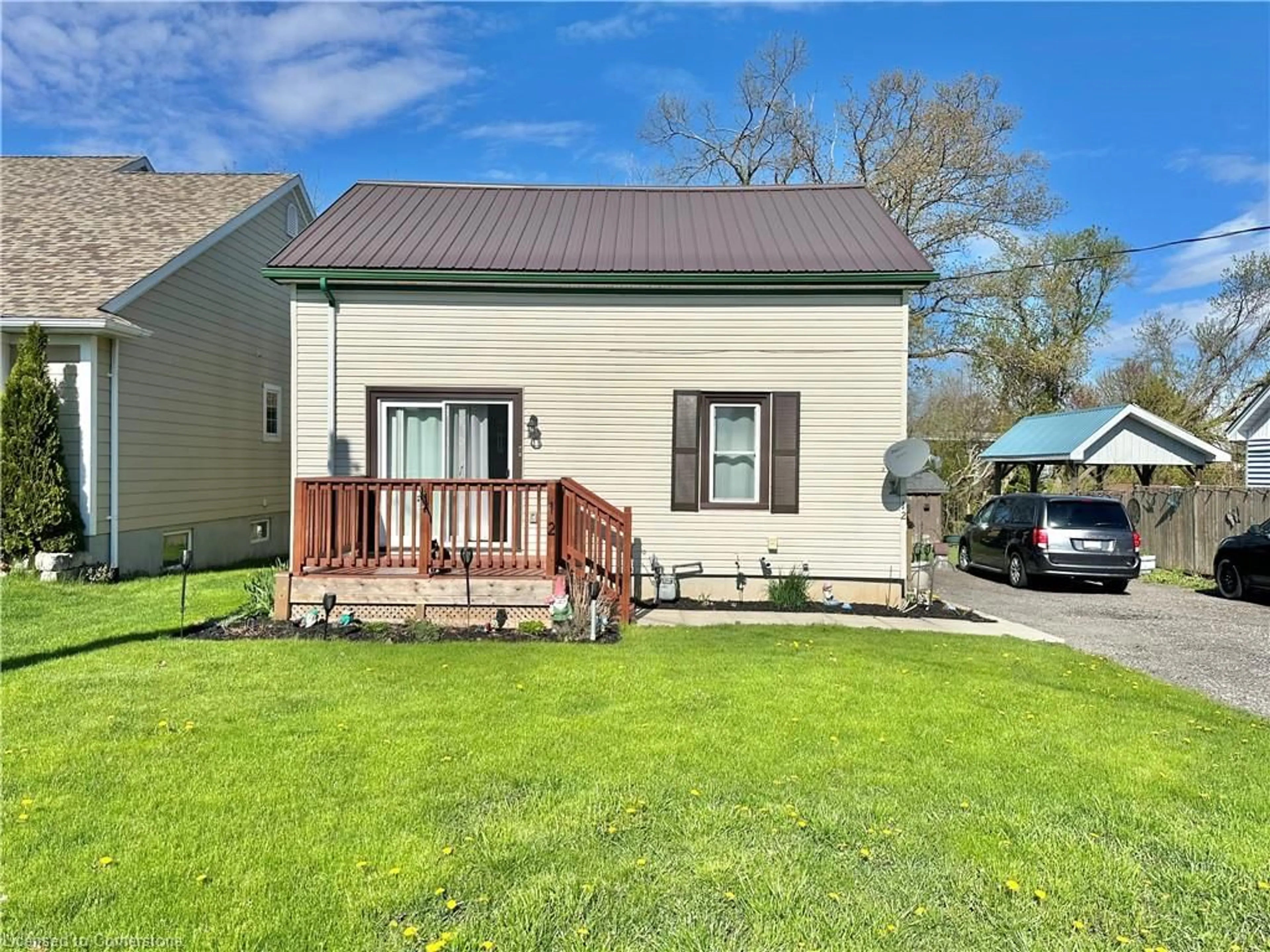 Home with vinyl exterior material, street for 12 Grave St, Port Rowan Ontario N0E 1M0
