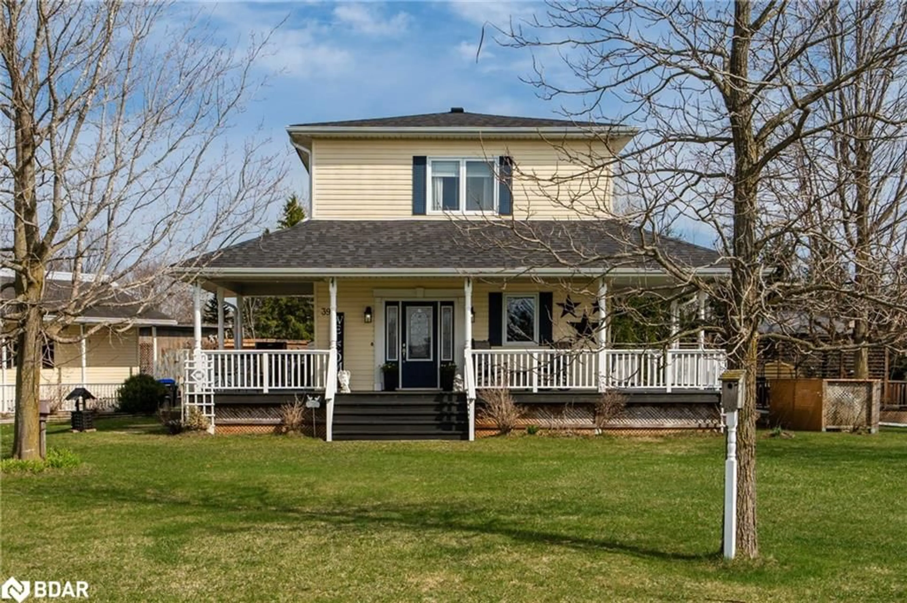 Home with vinyl exterior material, street for 39 Maple Ave, Glencairn Ontario L0M 1K0