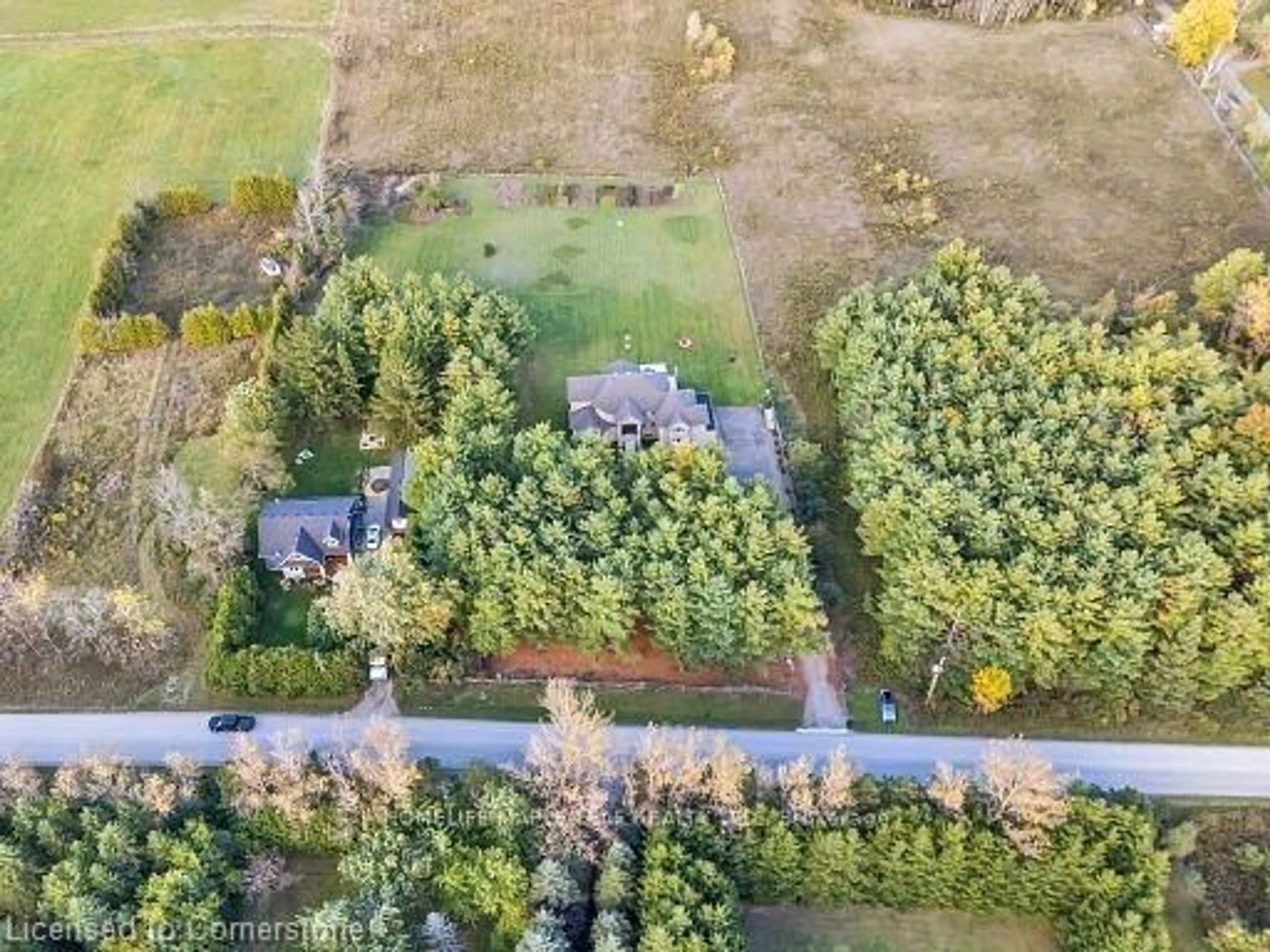 A pic from outside/outdoor area/front of a property/back of a property/a pic from drone, forest/trees view for 12601 Nassagaweya Puslinch Tline, Milton Ontario L0P 1J0