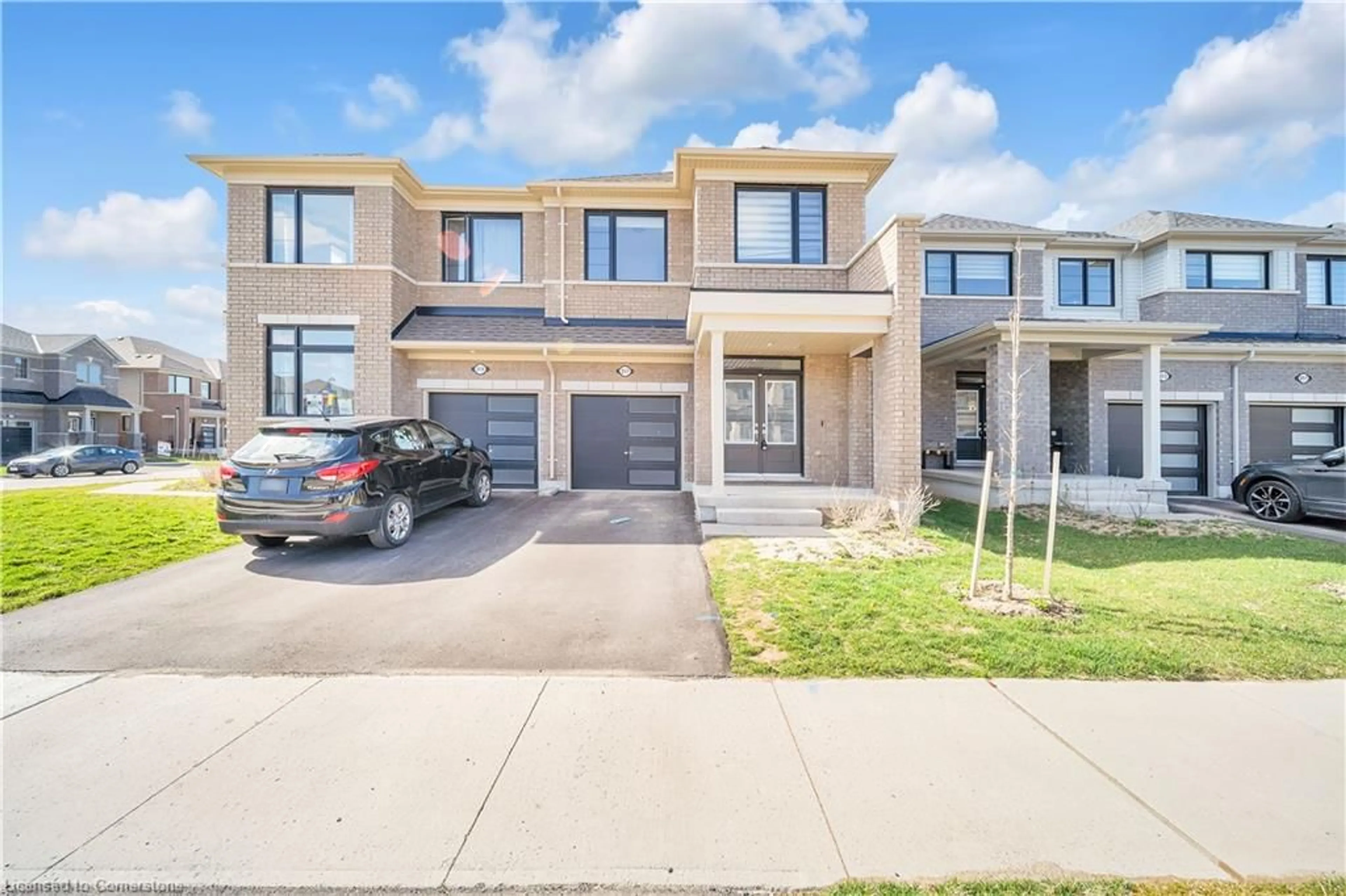A pic from outside/outdoor area/front of a property/back of a property/a pic from drone, street for 217 Povey Rd Rd, Fergus Ontario N1M 0J7