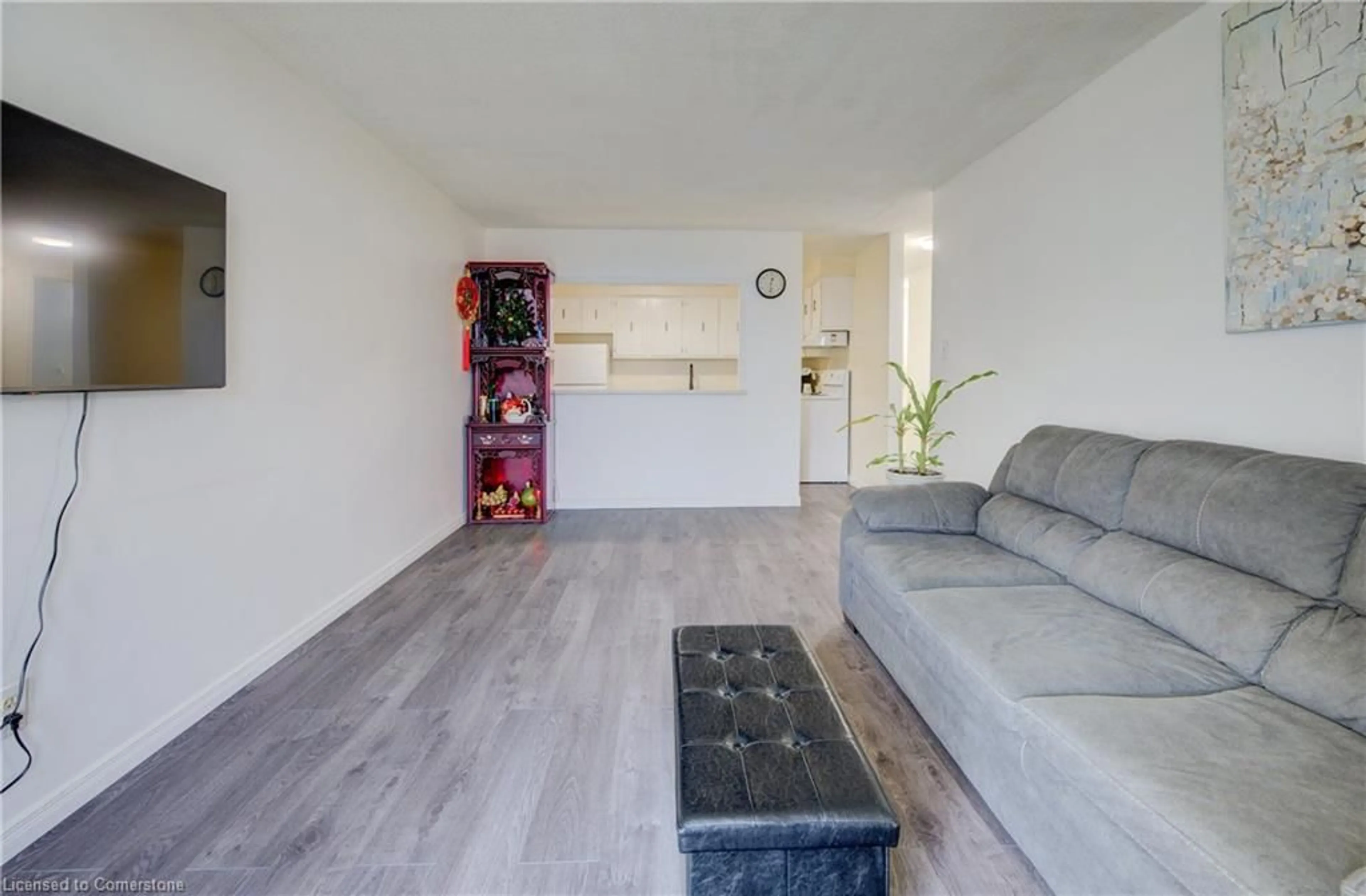 Living room with furniture, wood/laminate floor for 185 Kehl St #103, Kitchener Ontario N2M 5B9