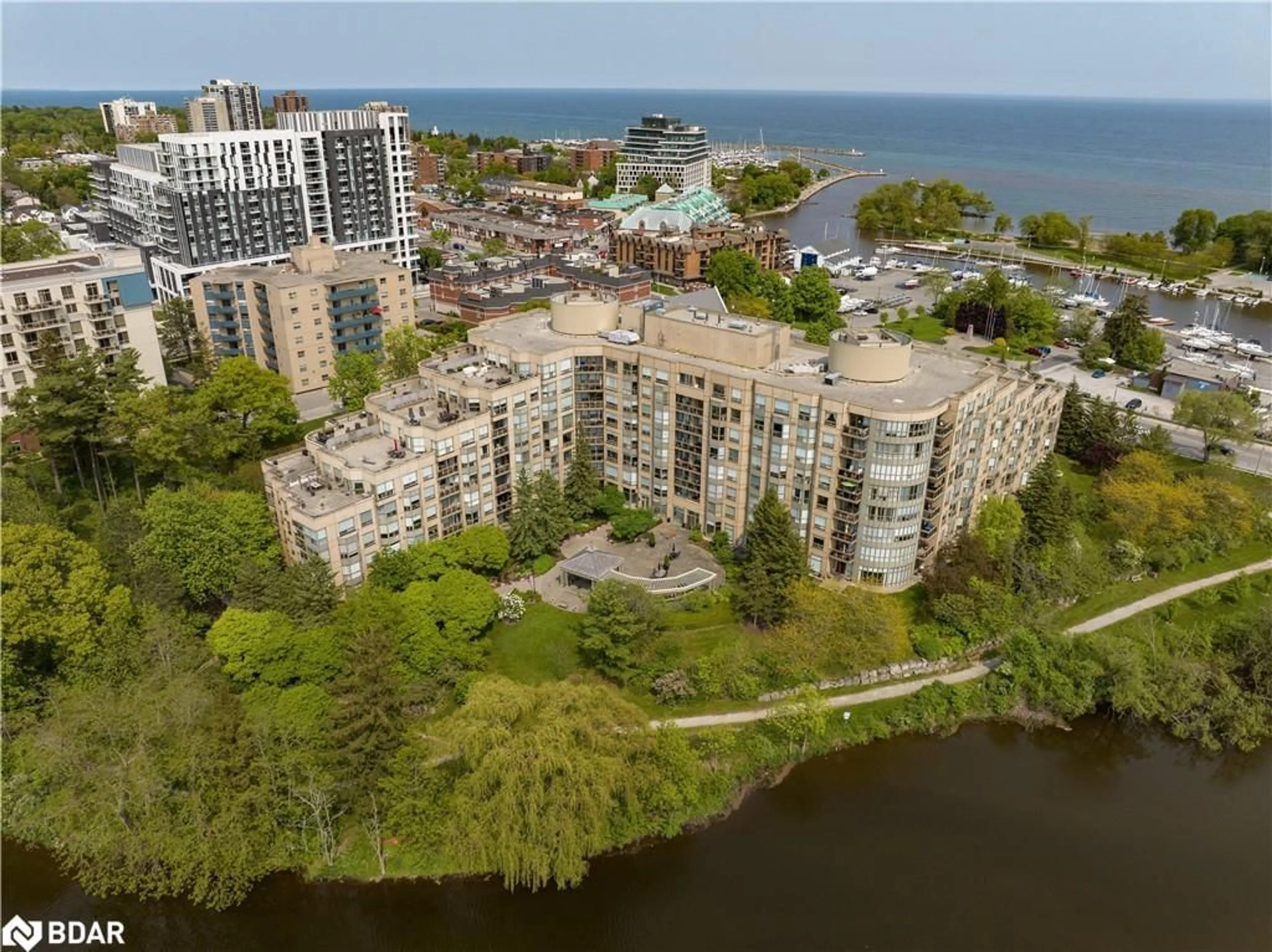 A pic from outside/outdoor area/front of a property/back of a property/a pic from drone, water/lake/river/ocean view for 2511 Lakeshore Rd #214, Oakville Ontario L6L 6L9