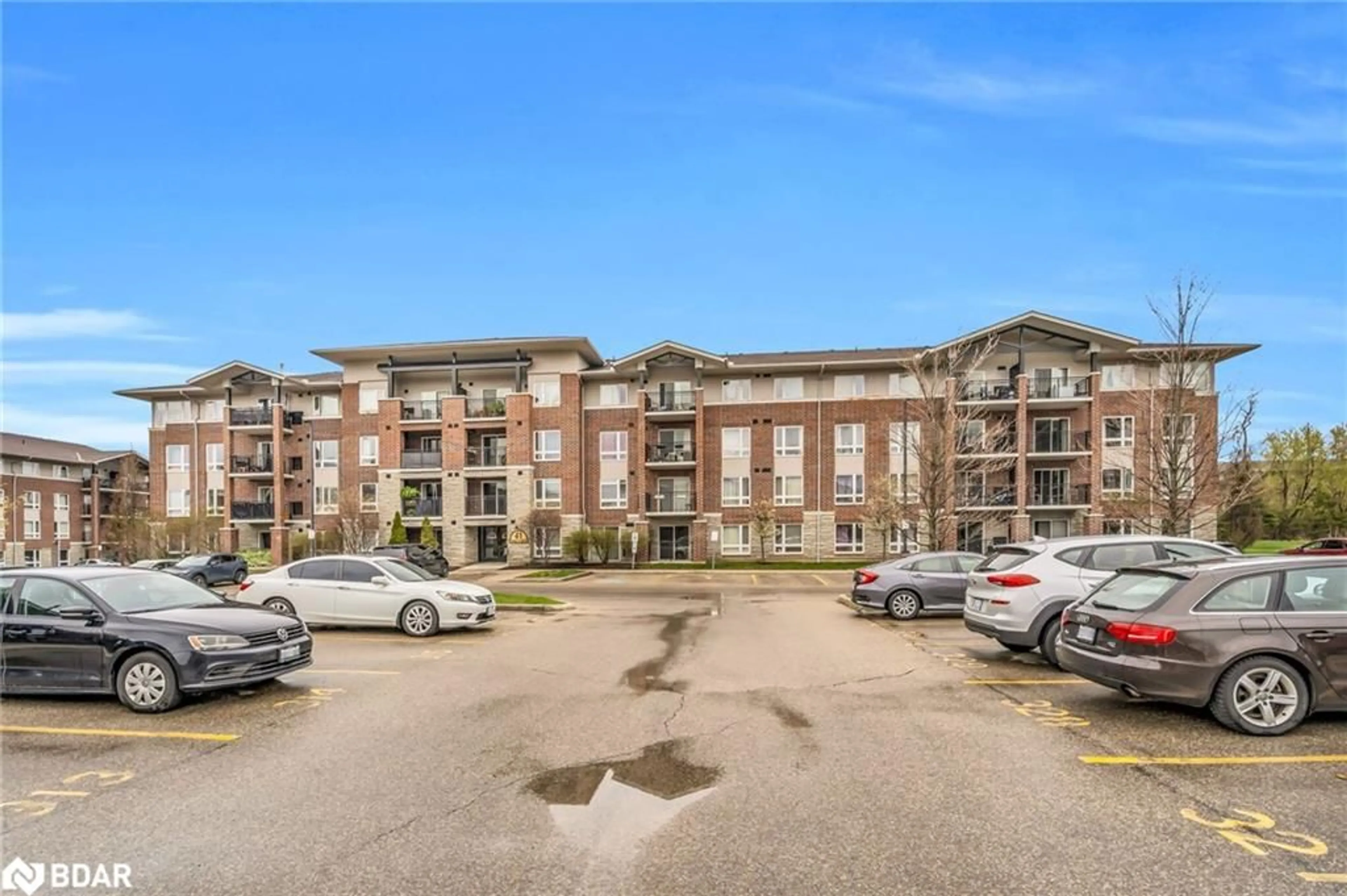 A pic from outside/outdoor area/front of a property/back of a property/a pic from drone, unknown for 41 Goodwin Dr #401, Guelph Ontario N1L 0E7