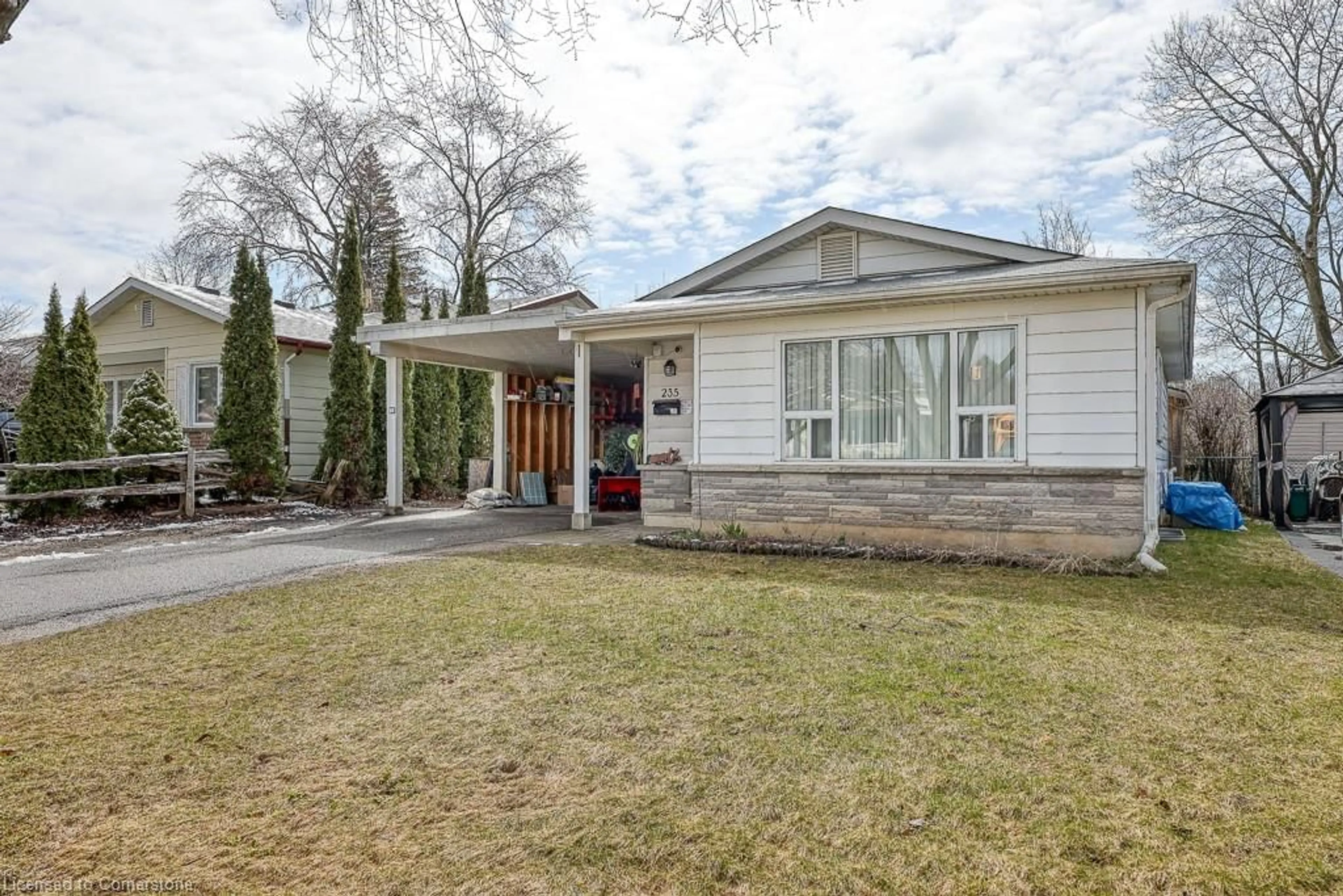 Home with brick exterior material, street for 235 Huntingdon Cres, Waterloo Ontario N2L 4P8